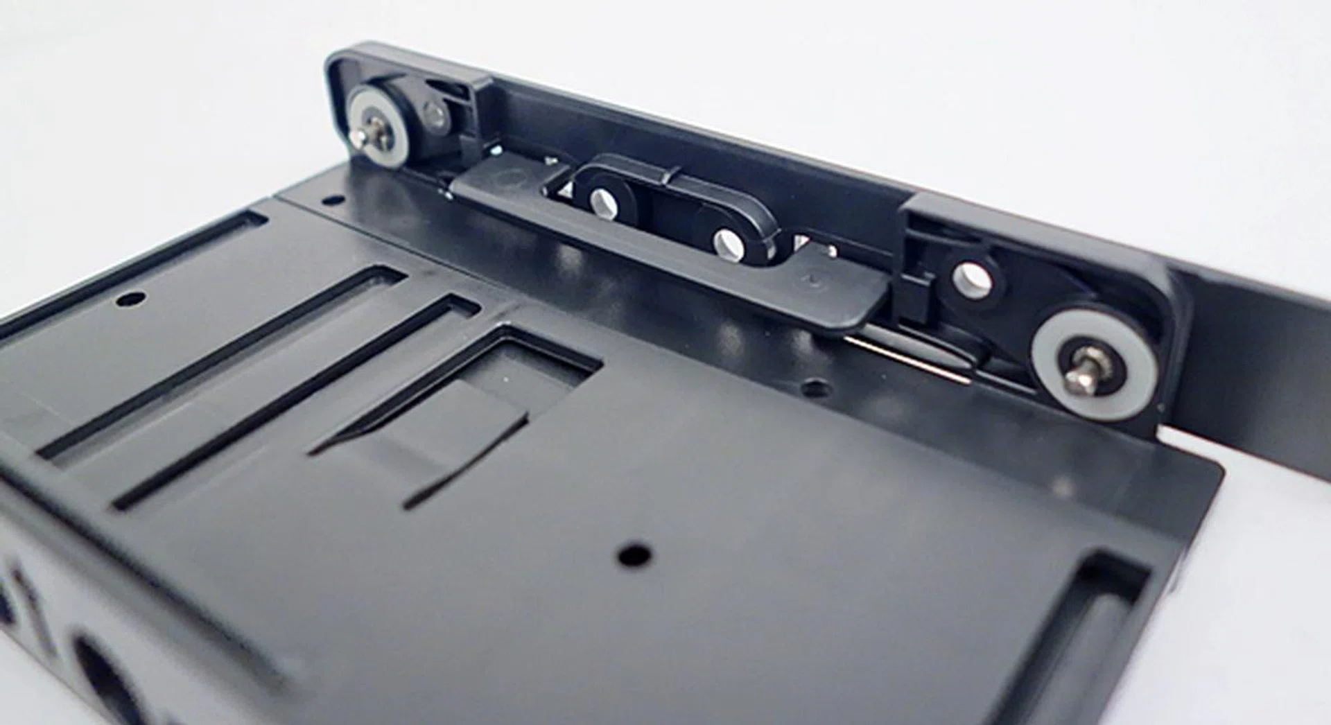 This is one of the flaps that is used to support the installed 2.5-inch drive.