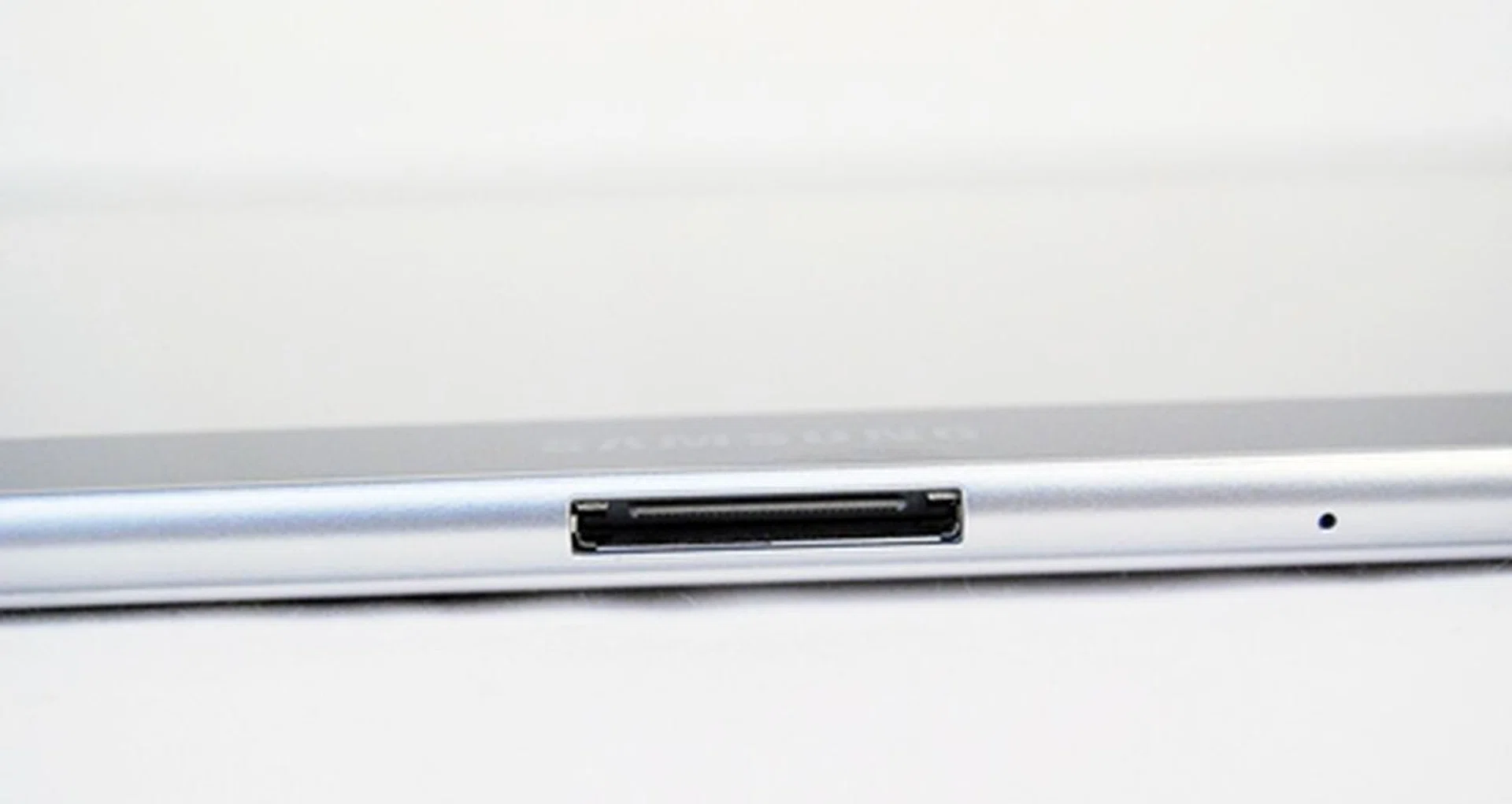 Located at the bottom section of the Samsung Galaxy Tab 10.1 is the proprietary connector port for charging and data transfer, with a microphone pinhole for video chat situated just beside it. Proprietary connectors are not a welcoming point, but that's something you just have to make do with this tablet unfortunately.