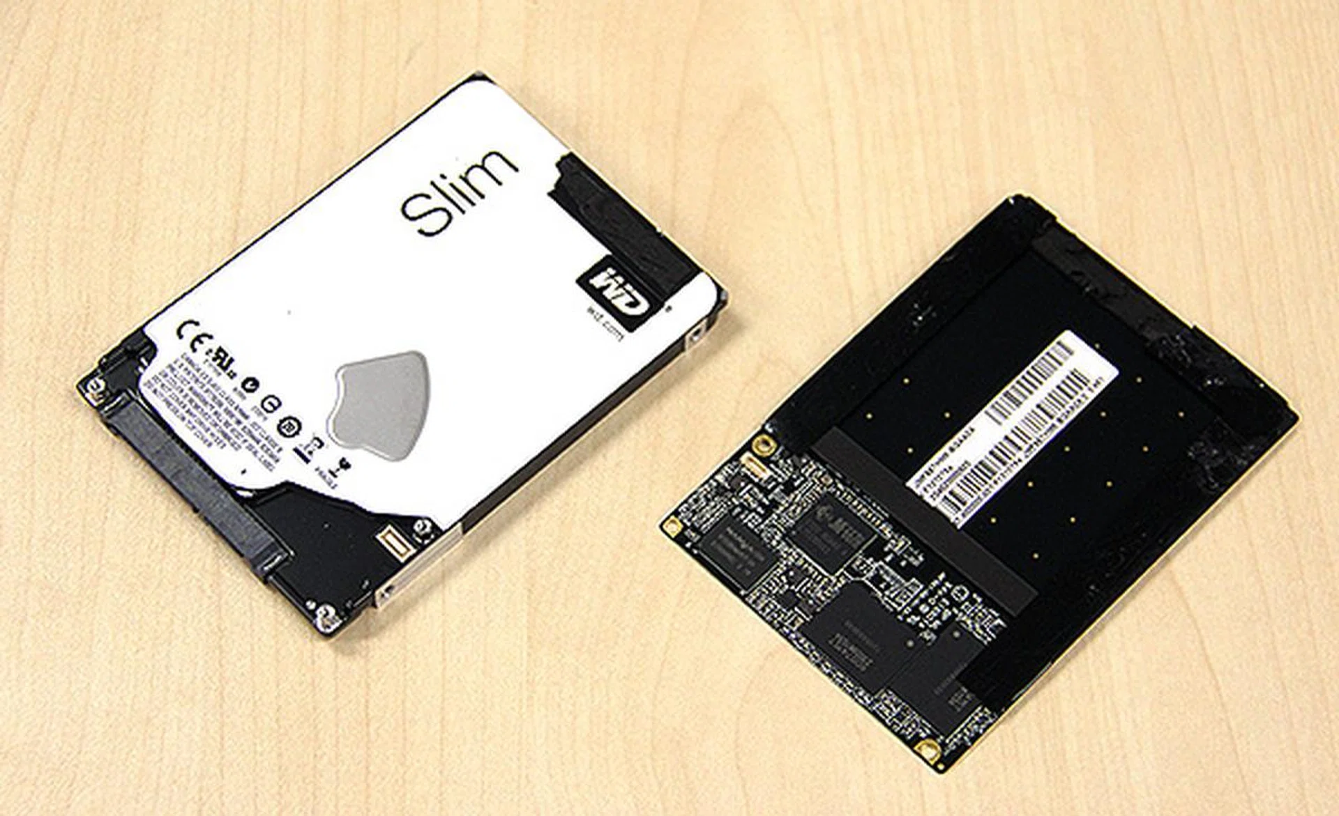 The SSD drive actually consists of a single metal plate and custom PCB that is secured to the hard disk drive by screws and tape.