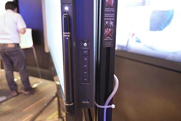 Physical controls are found on the right edge of the display, alongside a USB 3.0 port.