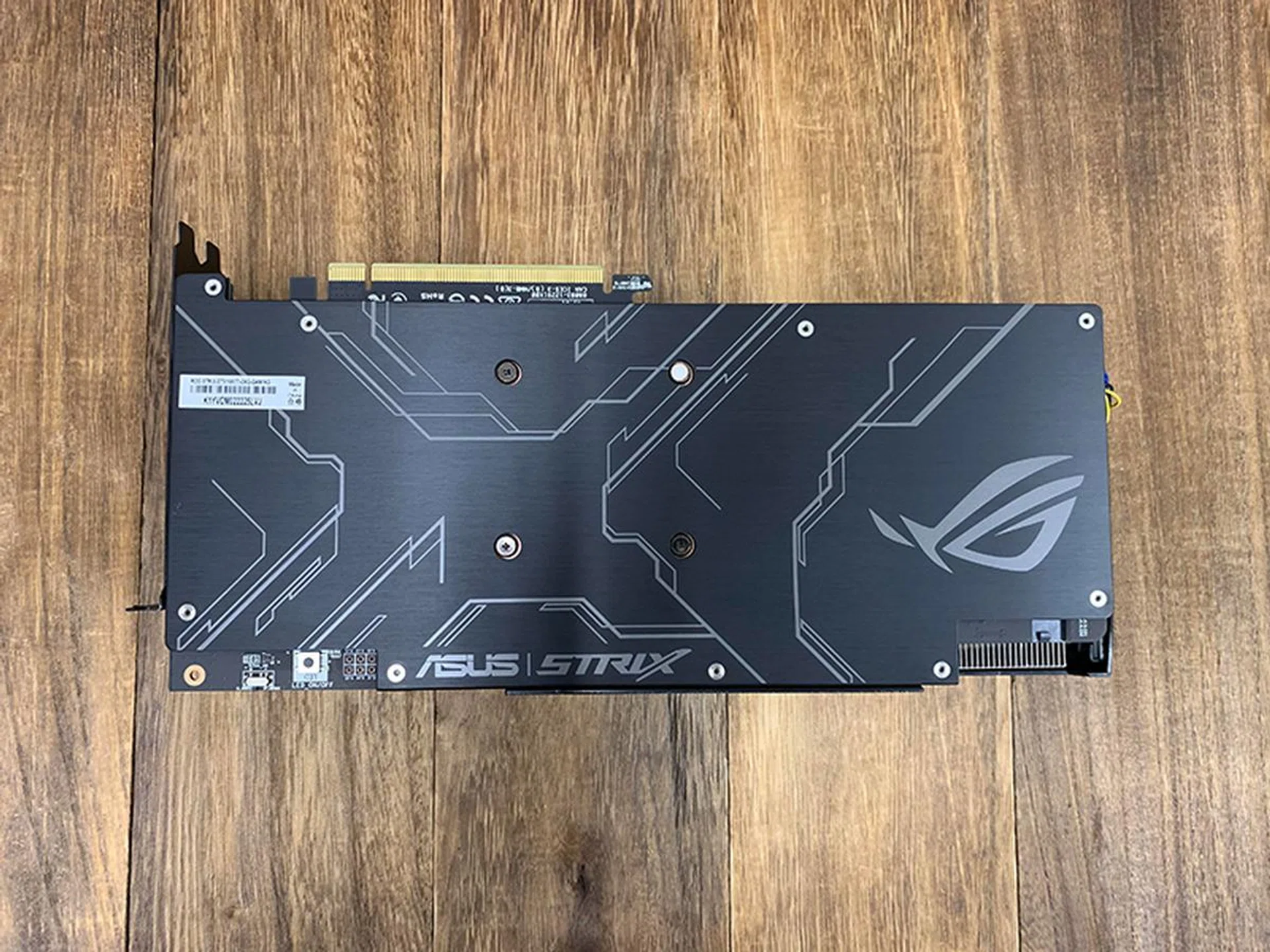 The ASUS card features a metal backplate for extra structural rigidity. 