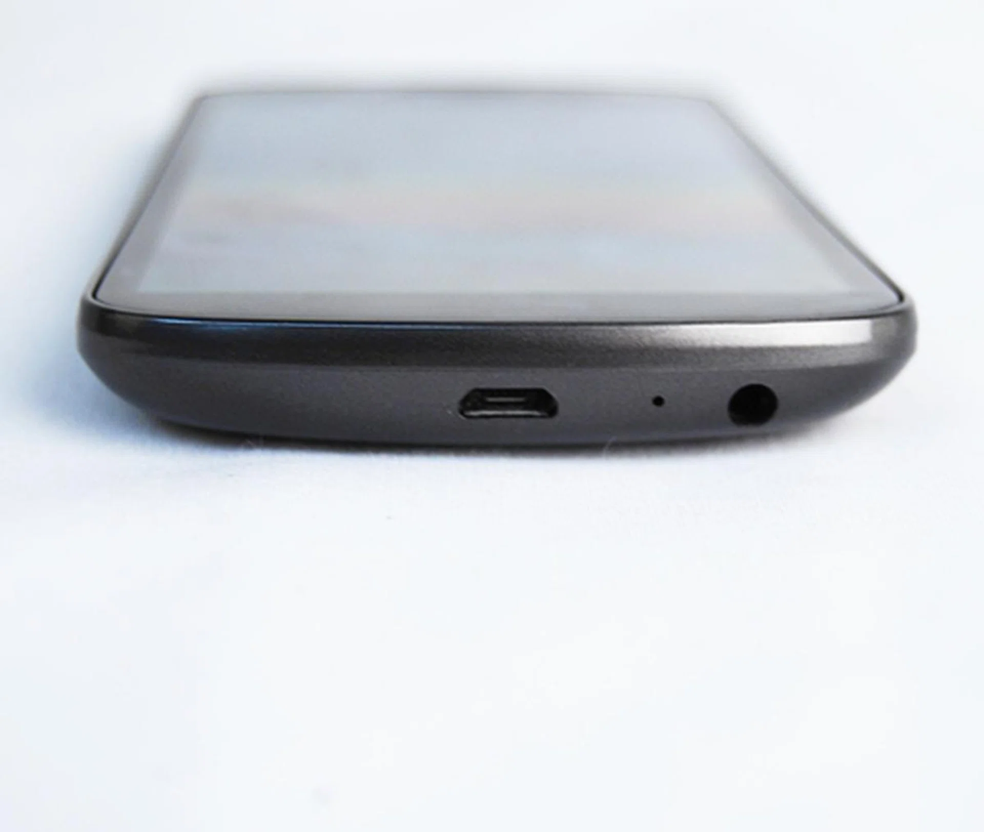 The bottom houses all the ports that the Galaxy Nexus has - a grand total of two. And they're the 3.5mm headphone jack and micro USB port. The top is kept bare.
