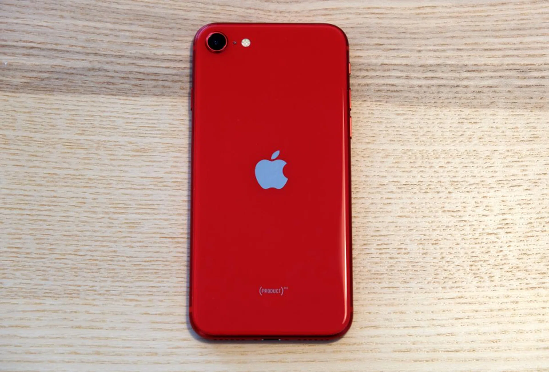 The back of the phone is glass and the red finish is achieved using a laborious seven-layer ink process.