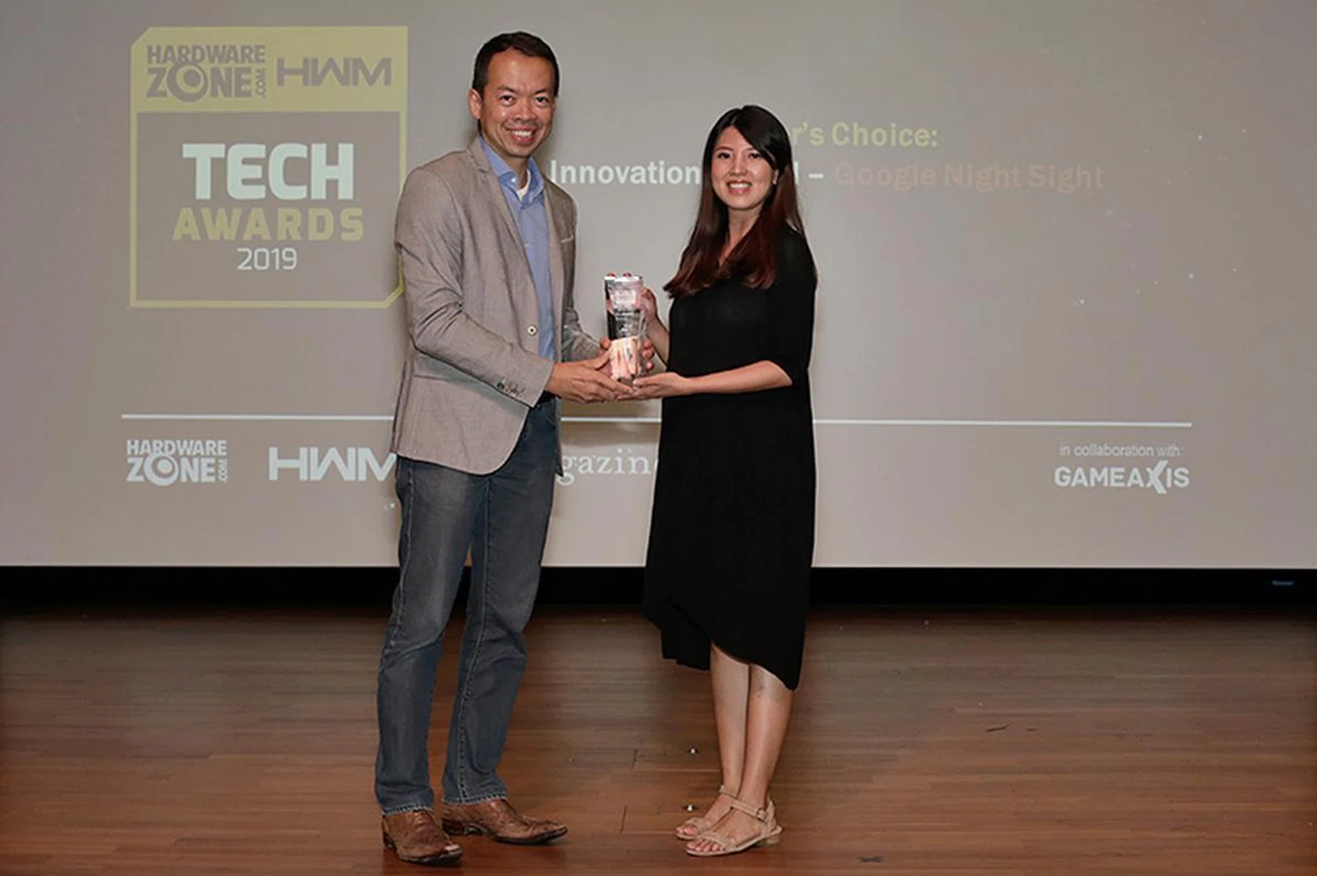 Google's AI-powered Night Sight computational photography tech also picks up an Innovation Award. Here's Ms. Angeline Leow, Head of Singapore Communications at Google, receiving the trophy.