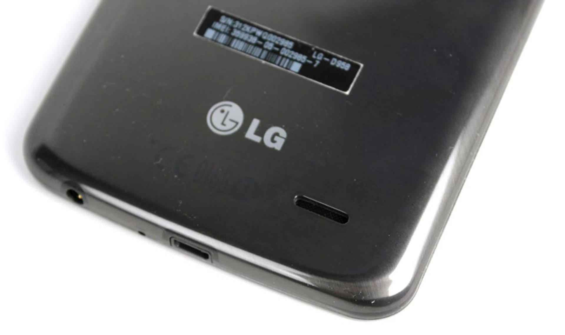 The G Flex's single speaker can be found on the lower-right rear of the device. Notice also the amount of dust clinging to the G Flex's rear.