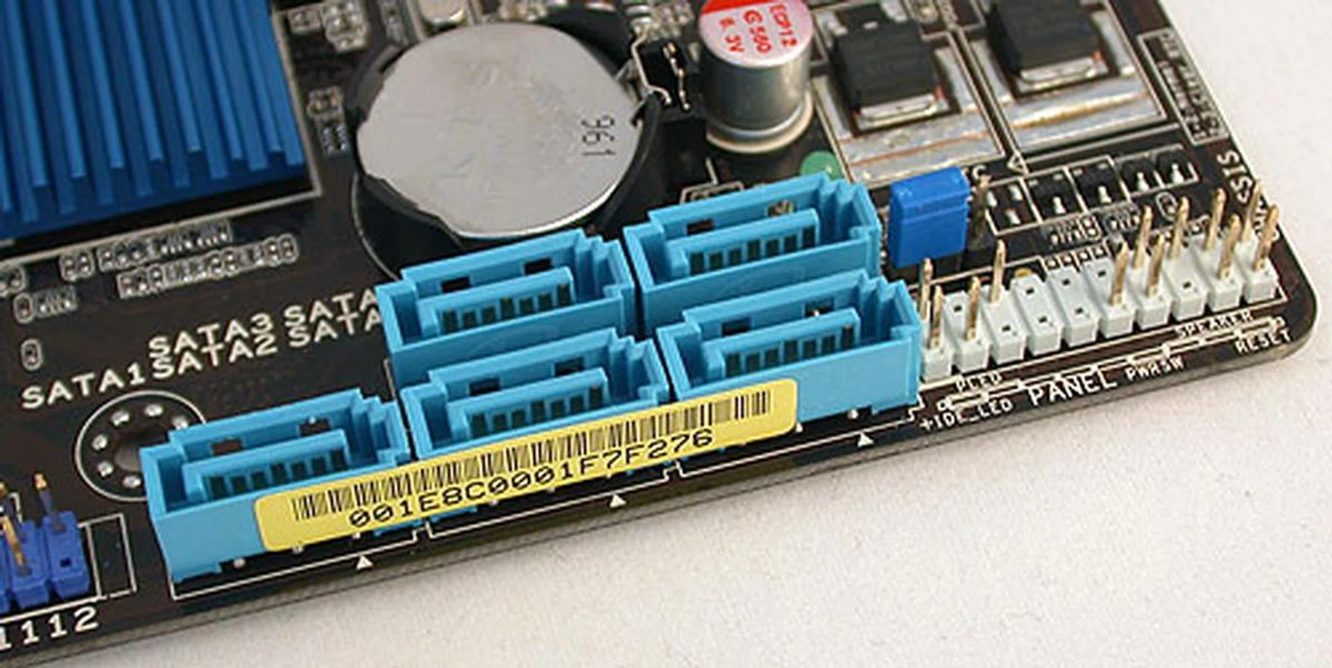 We aren't too keen on SATA ports that face upwards but at least they are at the edge of the board and less likely to interfere when connected to SATA cables. A clear CMOS jumper and the front panel connectors are other notable features here.