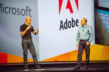 Microsoft CEO, Satya Nadella (left), made a special appearance at Adobe MAX 2014 to talk about Microsoft's support for touch in Windows. Joining him on stage is Adobe's CEO, Shantanu Narayen (right).