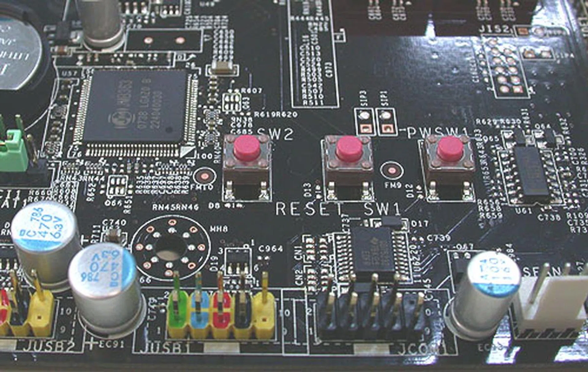 Like some other motherboards, there are buttons on the Diamond for power on/off and reset. You can also see the JMicron controller chip here on the left.