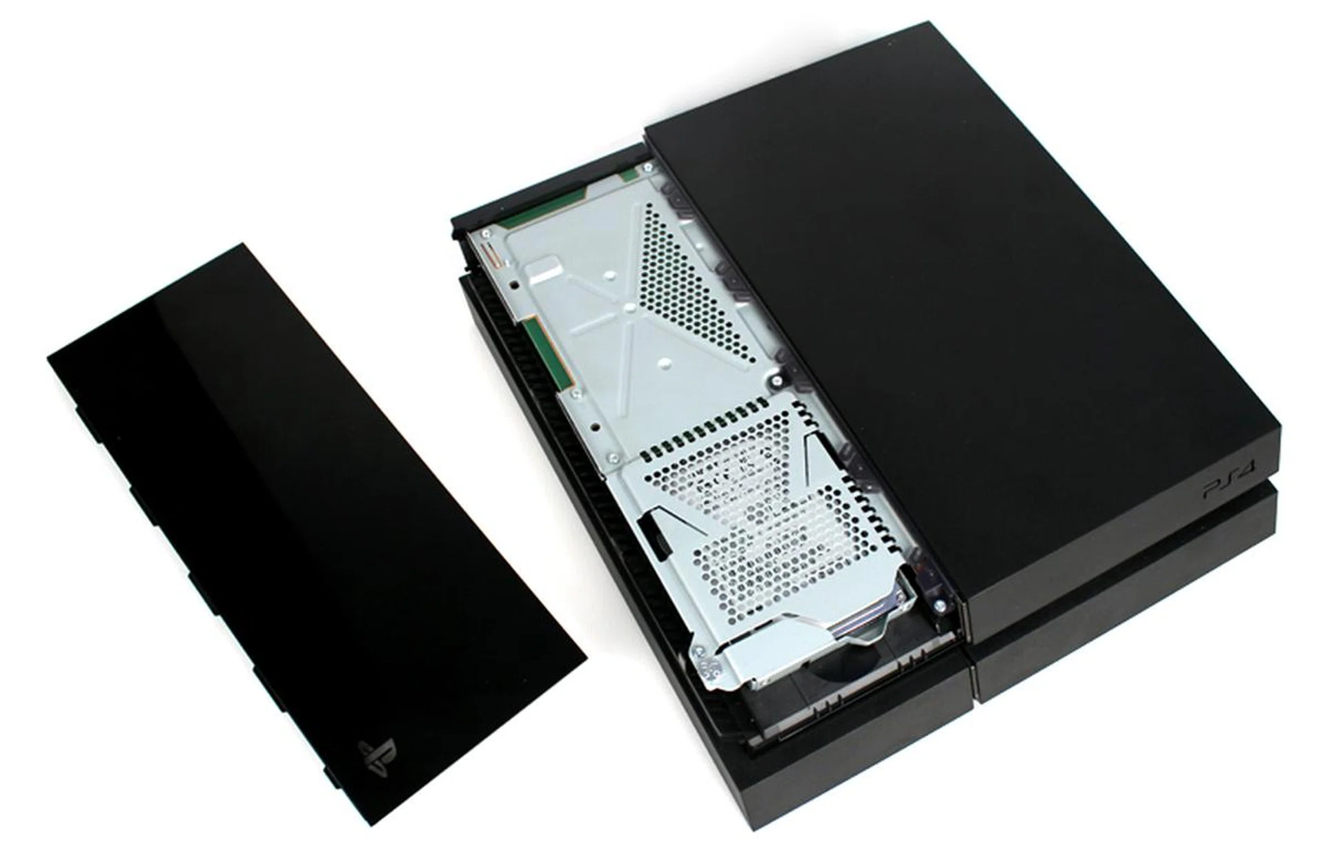 To install your new SSD, start by removing the PS4's HDD cover. This is the glossy panel on the top of the console - just slide it off.