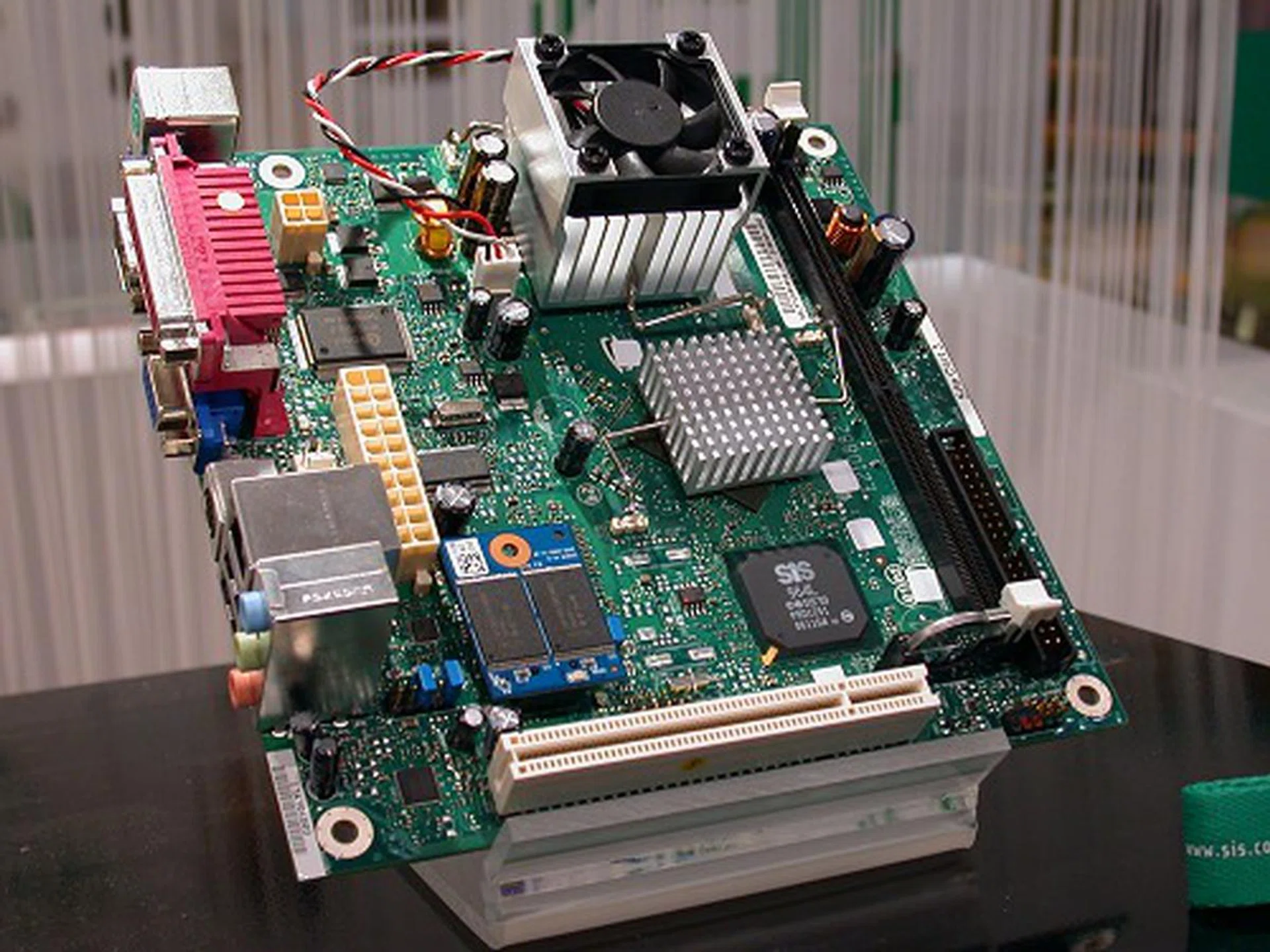  Here's a close-up of the board. An Intel Celeron processor is soldered on the board while a 2GB NAND flash acts as the primary storage device for this system. As the system specs indicate, this is targeted at office and schools requiring thin-client like machines where most data and applications are stored and accessed via central servers.  