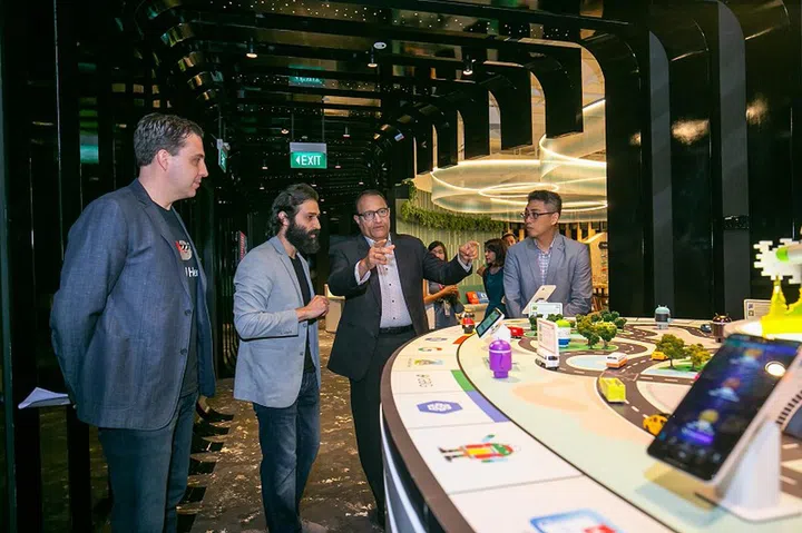 Google Cloud Managing Director (Asia Pacific), Rick Harshman (in foreground), and Developer Ecosystem Programme Manager, Sami Kizilbash, showing Minister S. Iswaran the Google Developer Space.