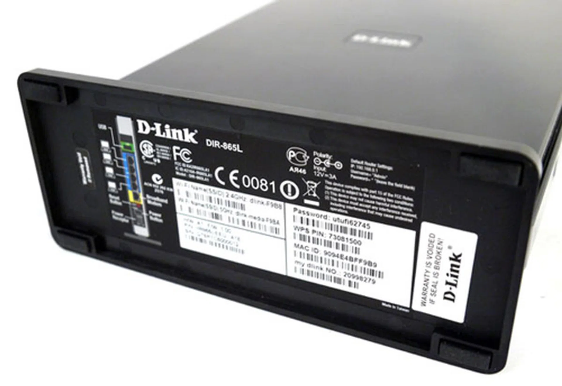 What have we here? You'll find a number of useful info plastered just below its base, including the router's default WPS PIN and MAC (physical) address. 