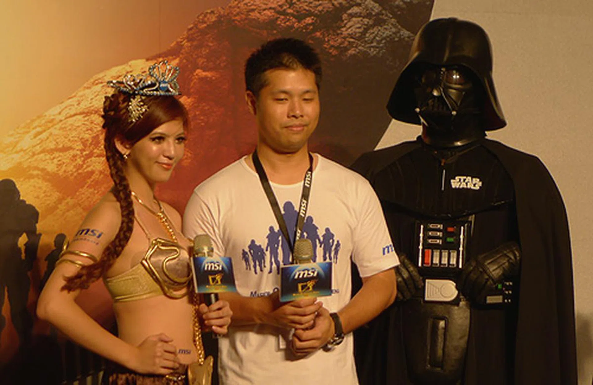 The winner of the Princess Leia voting competition, Wong Tzu-Chi, posing with Jason Lee, Director of the Component Department MSI, and Darth Vader, Lord of the Sith.