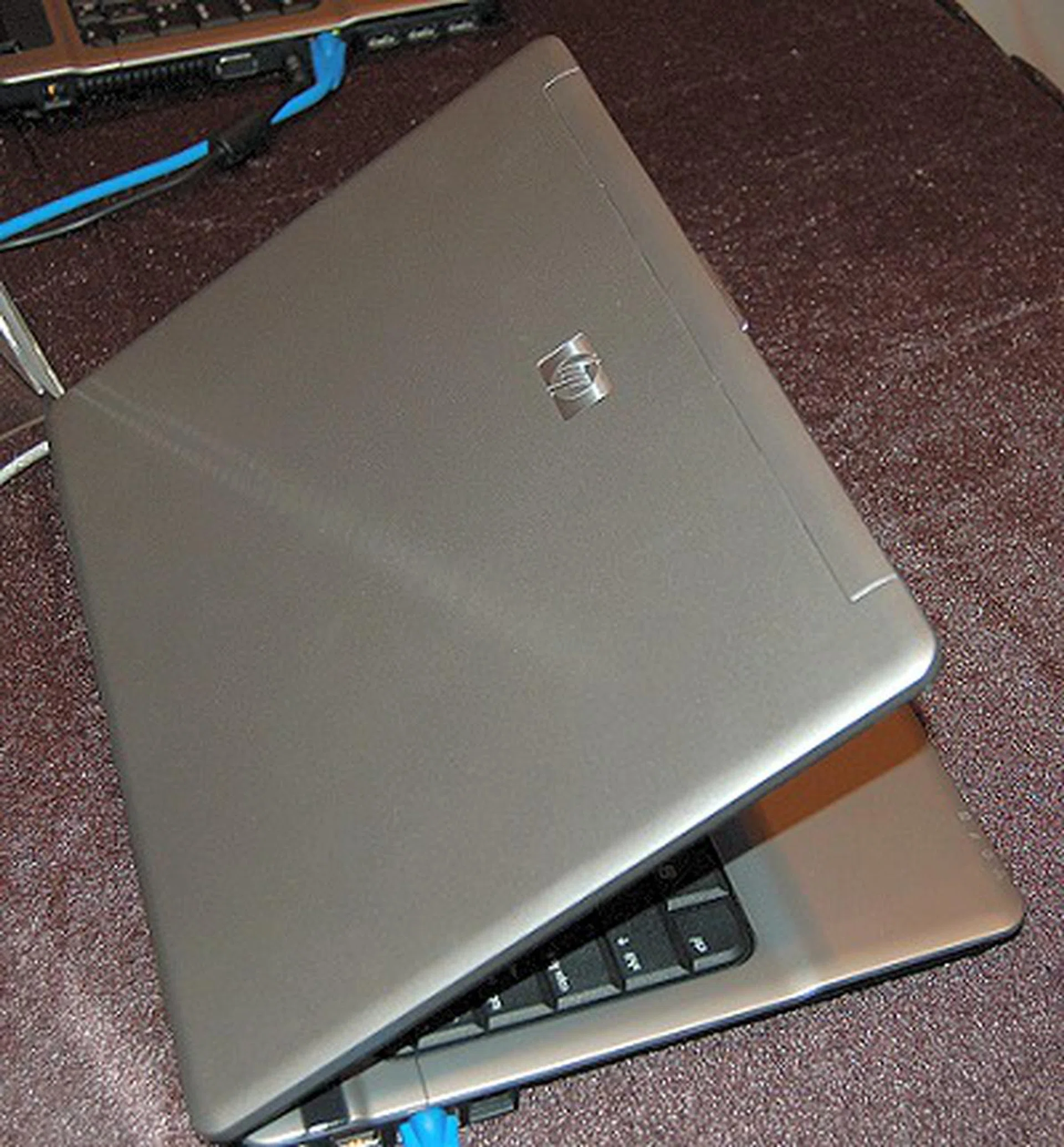  The outer cover of the notebook revealing a less serious but still professional feel from its silver-grey finish.  