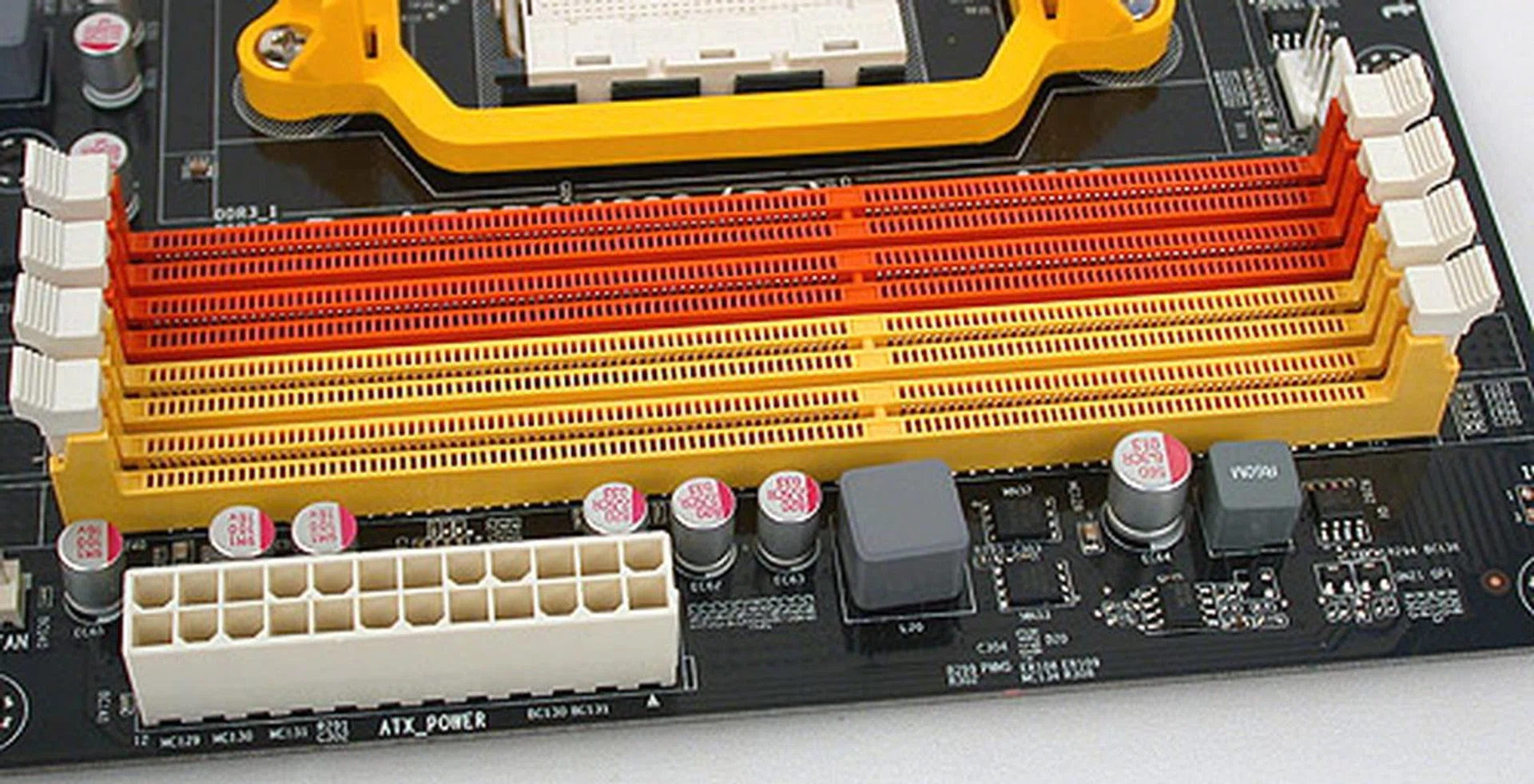 A typical four-DIMM setup with the 24-pin ATX power connector nearby. Color-coded for easy and idiot-proof installation. 