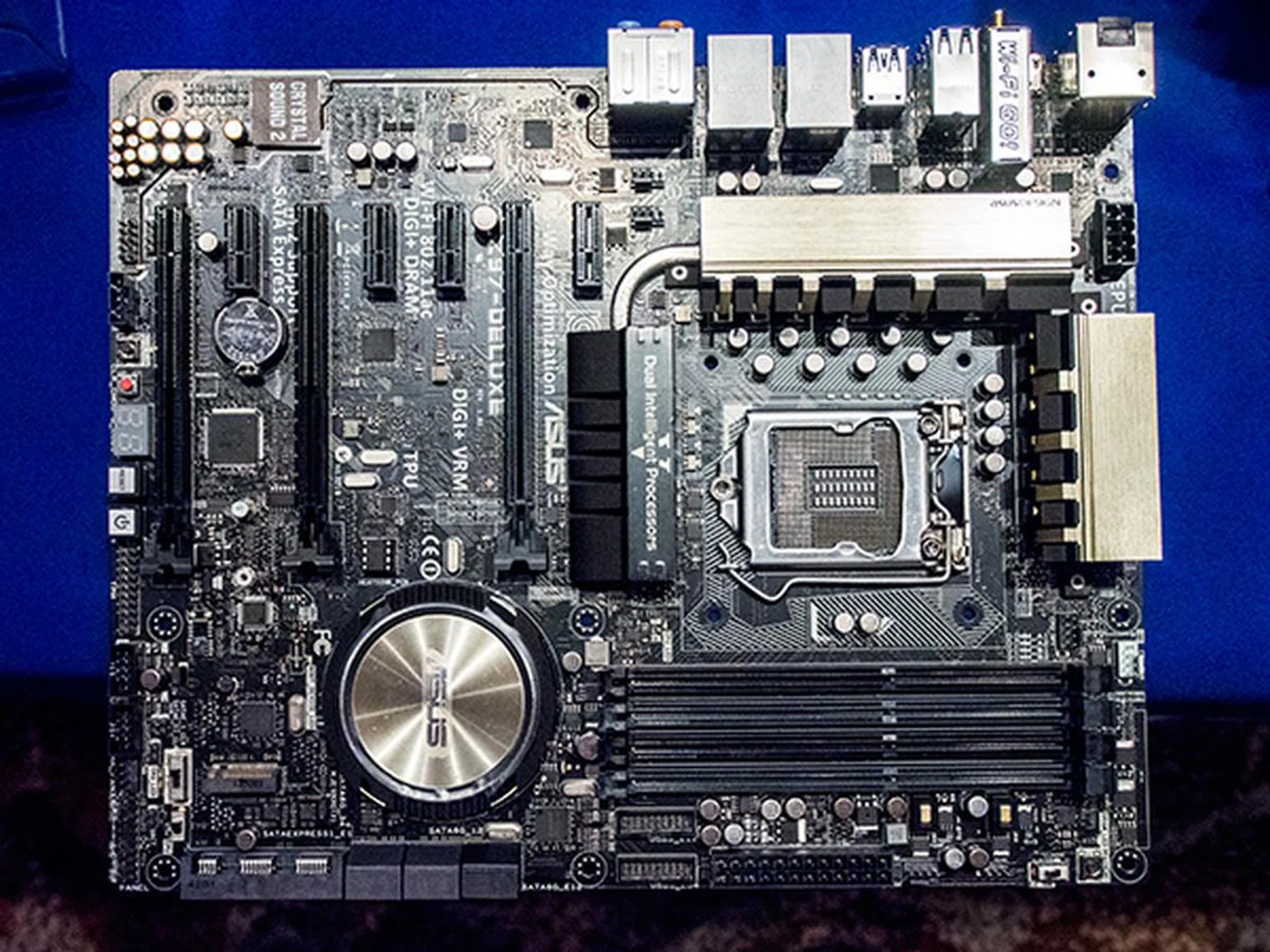 The ASUS Z97-Deluxe with one x16 PCIe 3.0 graphics slot, one x16 PCIe 2.0 graphics slot and one x4 PCIe 2.0 graphics slot. It also has four x1 PCIe 2.0 slots, 4 DDR3 memory slots supporting DDR3-3300 memory, SATA Express, M.2 slot, 10 SATA ports, 10 USB 3.0 ports, 8 USB 2.0 ports and dual Intel LAN ports.