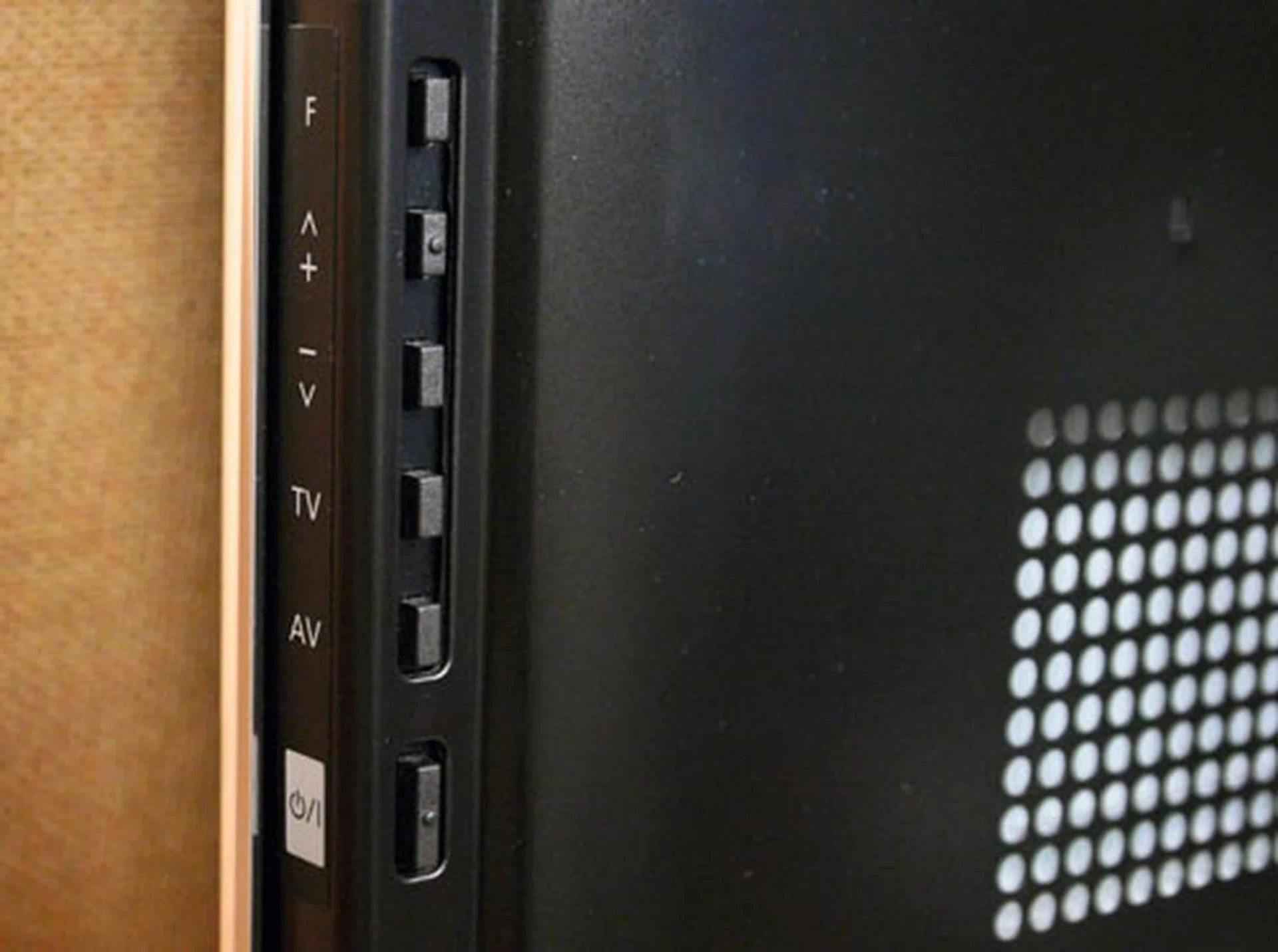 Push-button controls for volume and source selections are available just by the side of the Viera. The TV's main power switch is located here as well. 