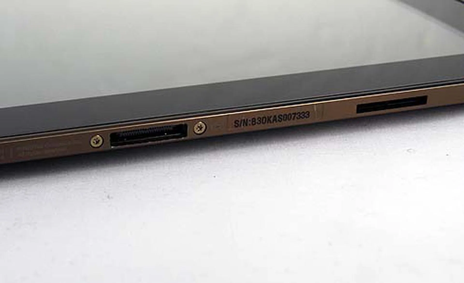 The only port you'll find on the bottom is the one for docking. The big gaping hole next to it (which we're guessing) is for securing and stabilizing the tablet when plugged into the keyboard dock.