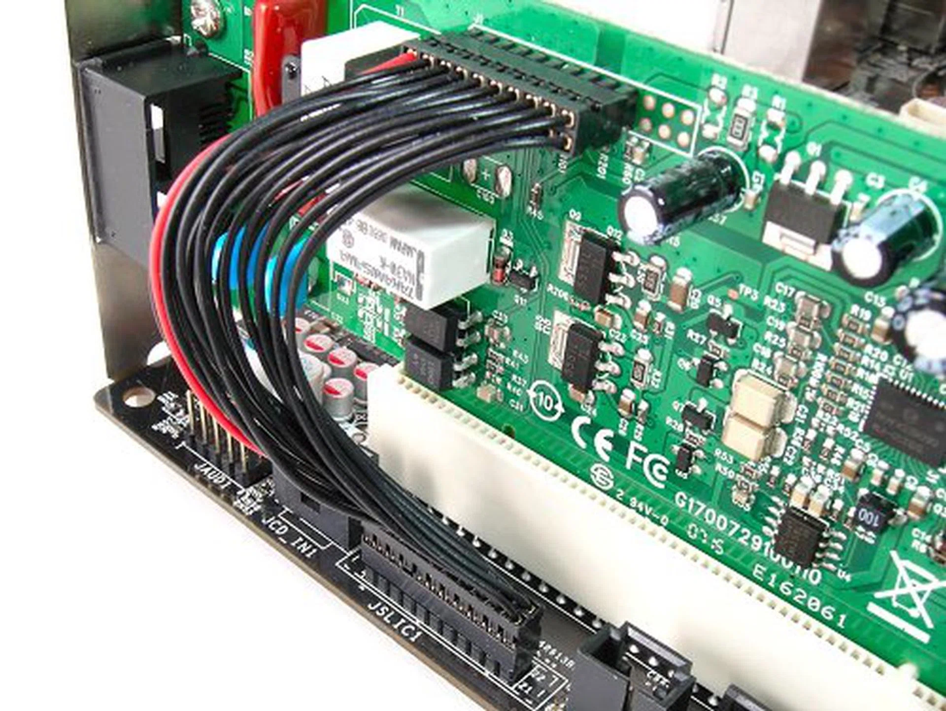 VoIP connection functionality is actually handled by the Realtek ALC888T CODEC. Just connect the cable to the board. The SkyTel card just acts as a switch between IP and analog lines.