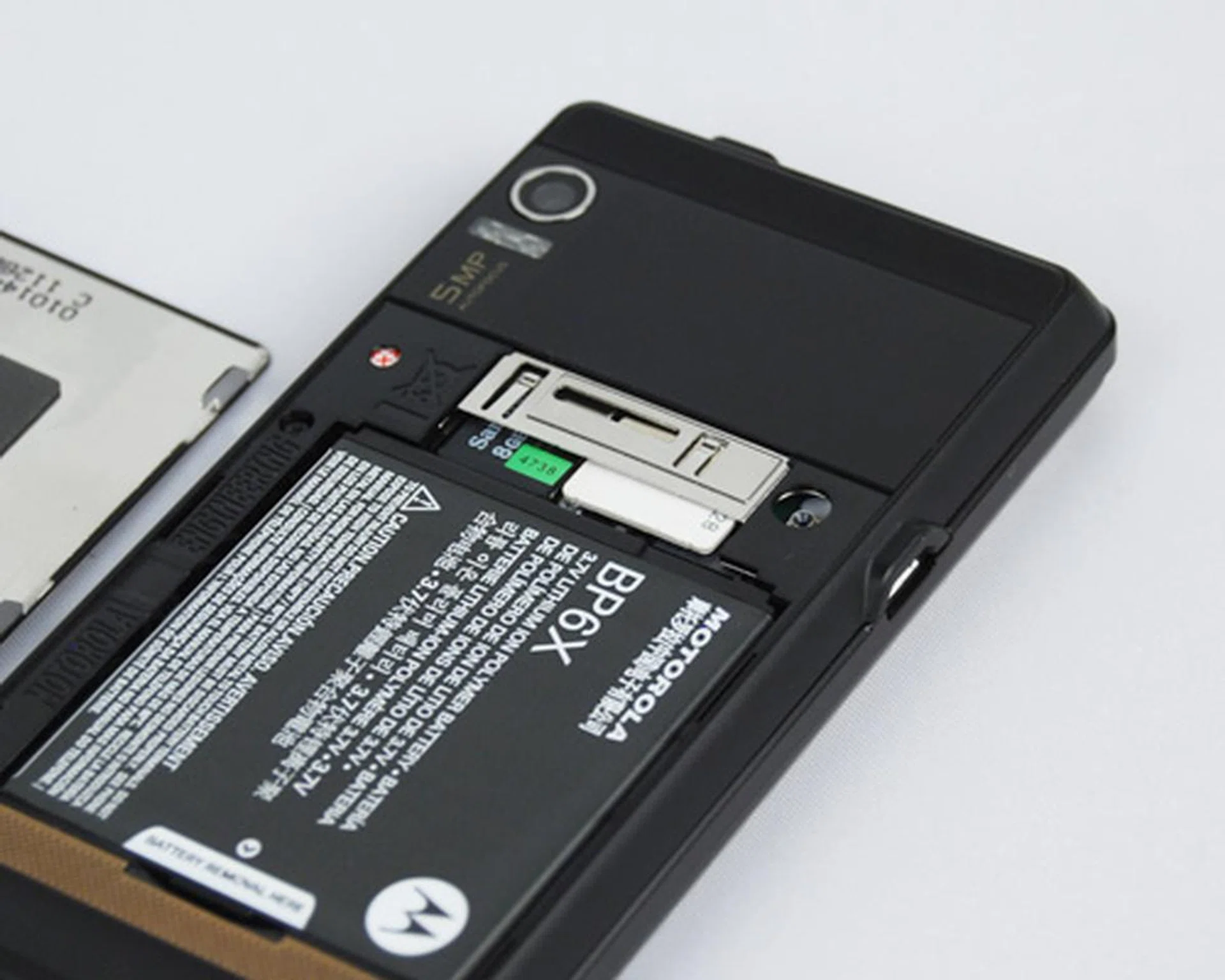 Underneath, we have the battery, which has to be removed to either insert or remove both the microSD and SIM card.