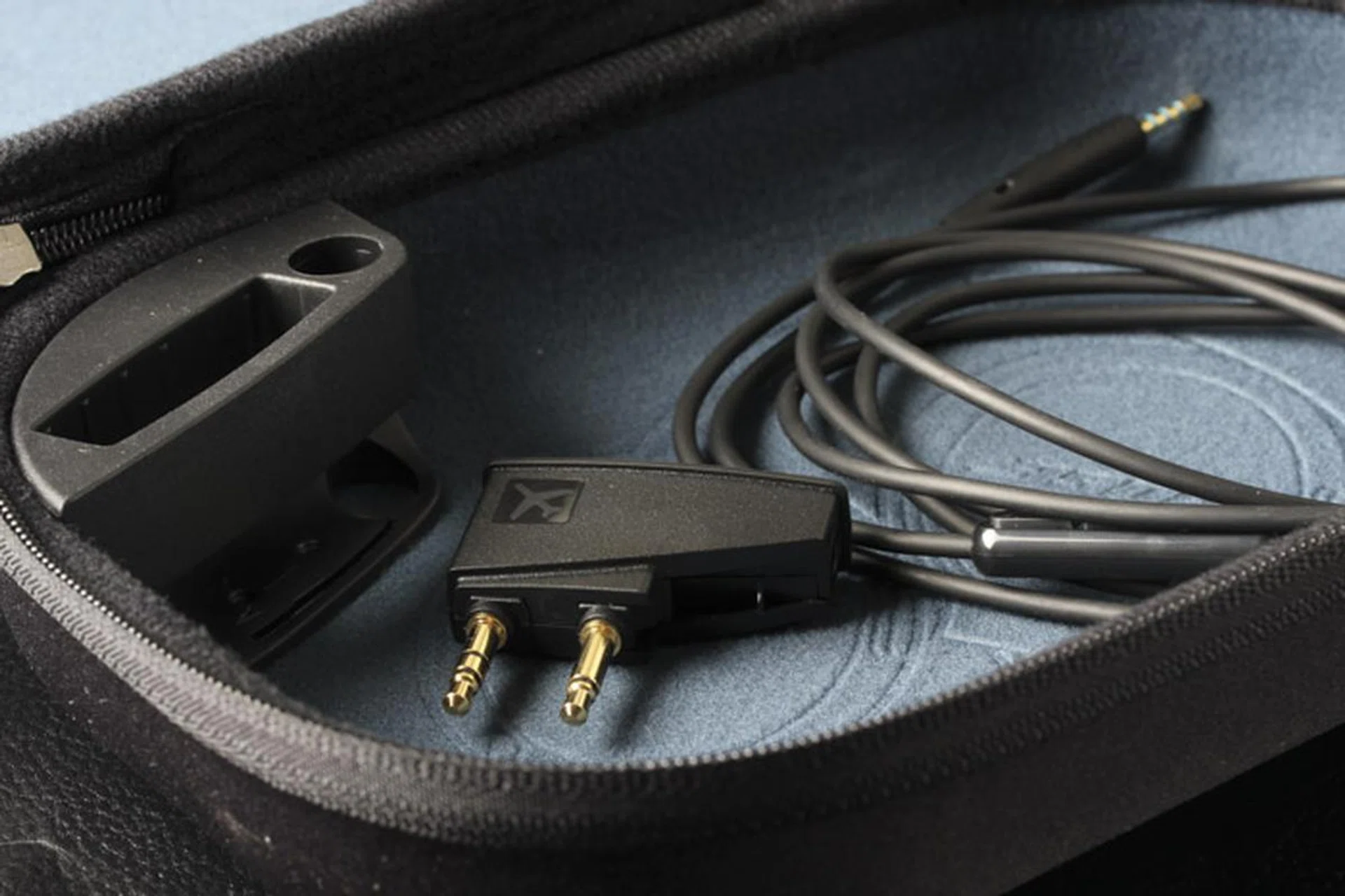 Airplane jack adapter, battery holder and a cable with in-line mic make up the rest of the package.