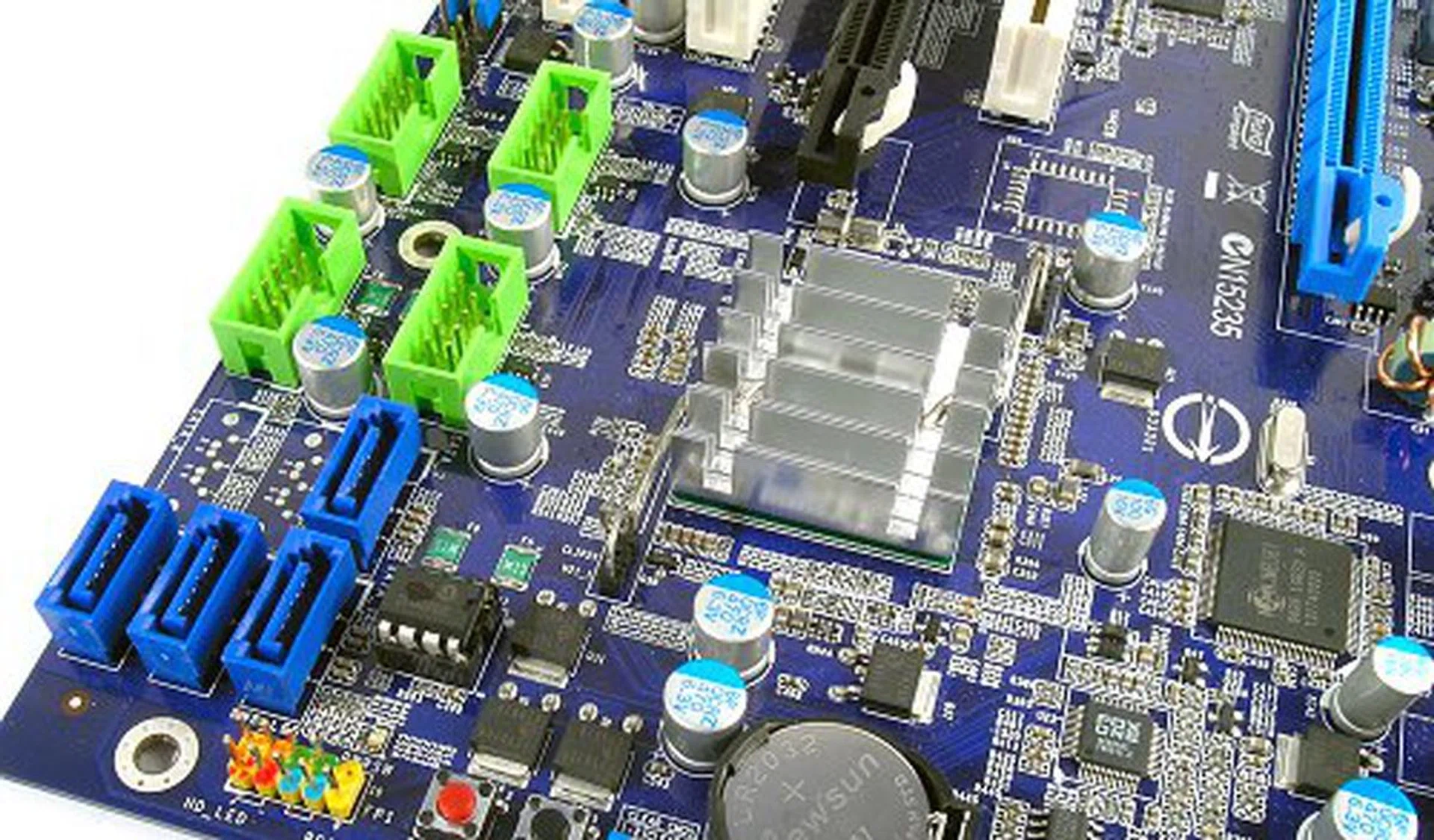 The Foxconn P35A only makes use of the ICH9 Southbridge and not the 'R' variety. This means that the board will not support AHCI or RAID. It also seems that there will only be four SATA connectors internally. The green headers on top are all USB 2.0 headers; the P35A does not have FireWire support.