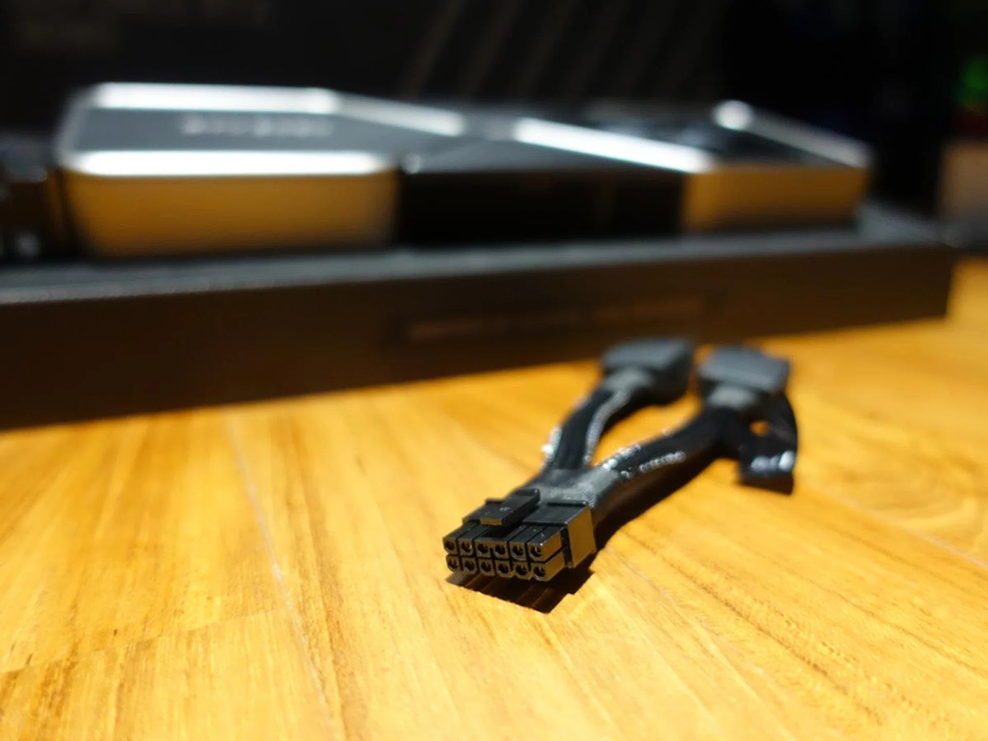 Thankfully, NVIDIA will bundle an adapter, if an awkward one, that splits and hangs out the side of the card.