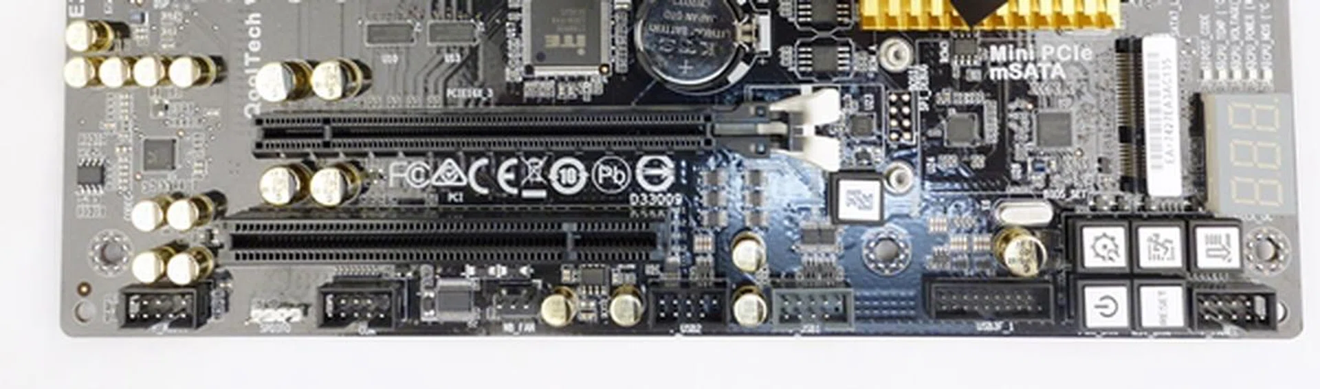 From the left, there is a front panel audio header, a S/PDIF out header, COM port header, a fan connector for cooling the northbridge, a pair of USB 2.0 headers, a USB 3.0 one, and a system panel header.