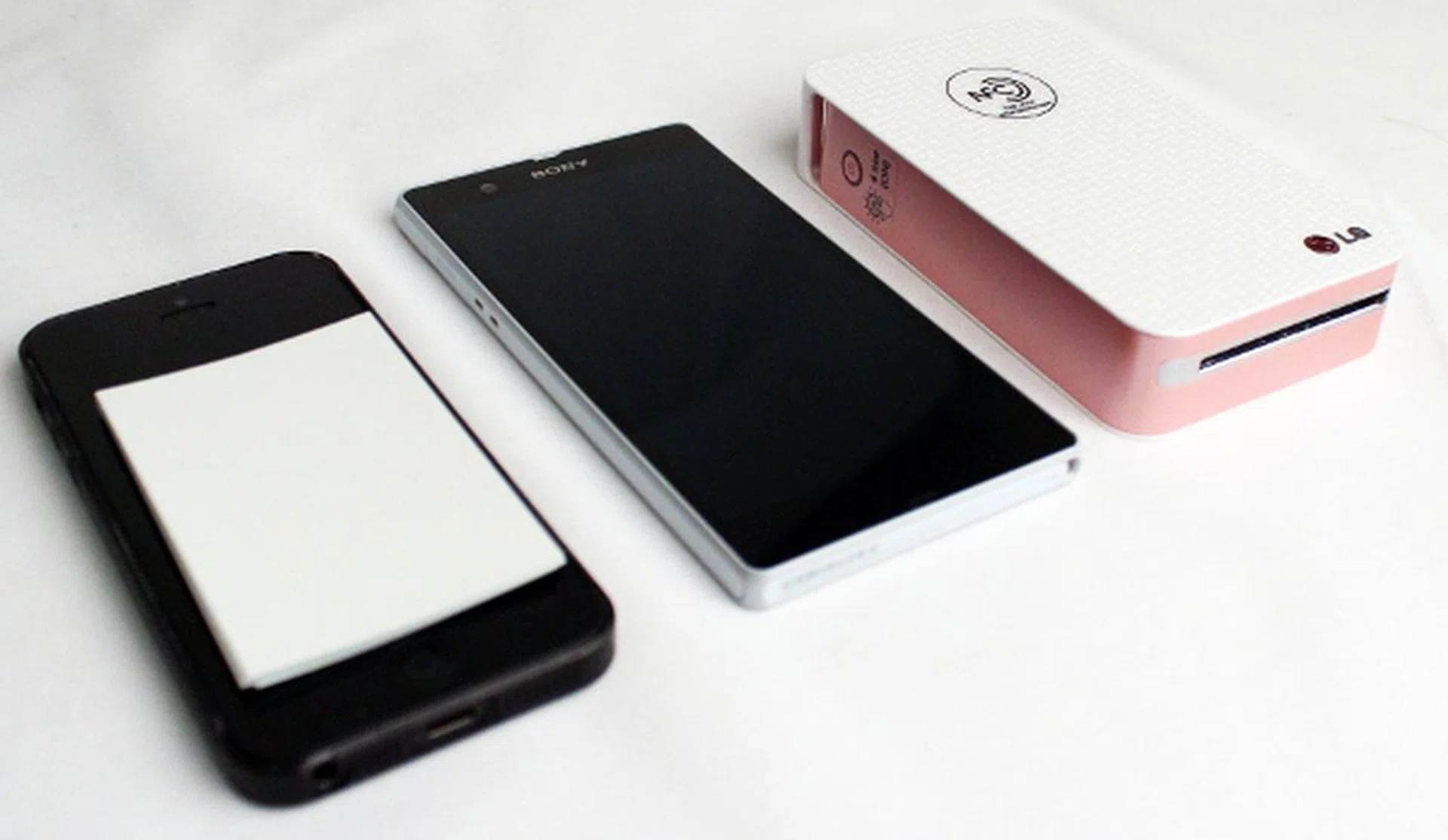 Pictured here (from left to right) is the iPhone 5, Sony Xperia Z and the LG Pocket Photo. The Zink paper is also placed on top of the iPhone to give you a reference on how large your prints will be.  