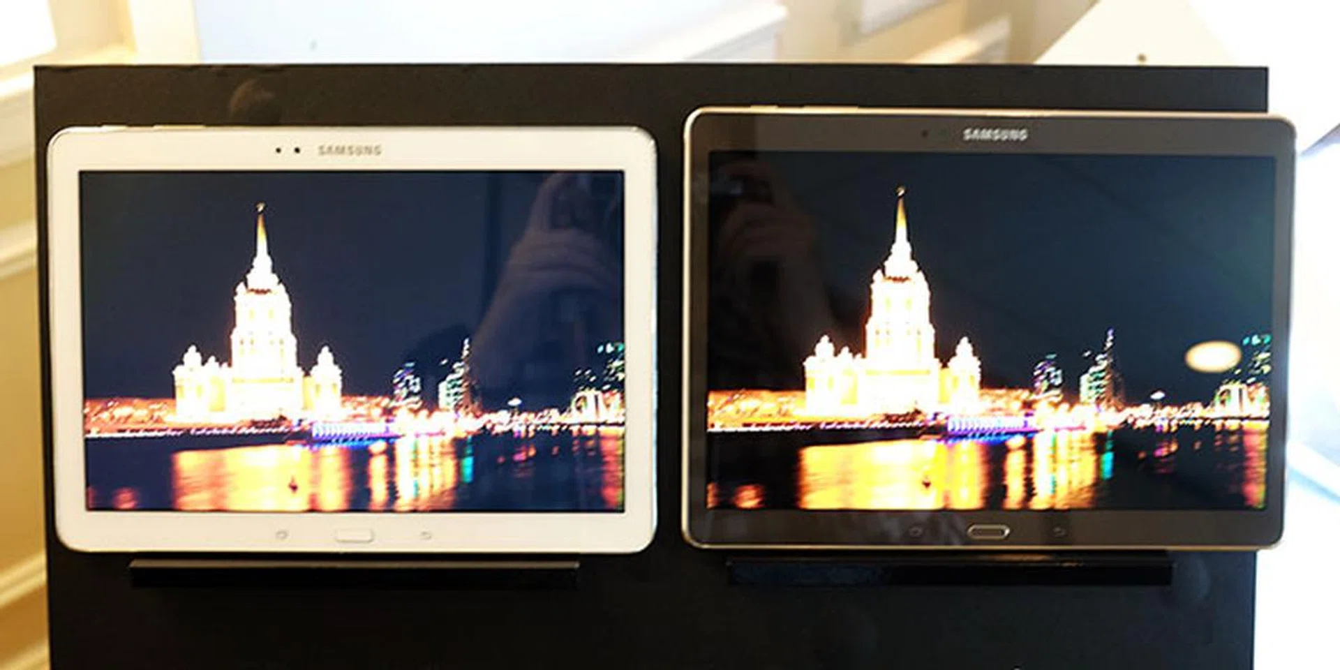 The Tab S (right)'s Super AMOLED display has much better contrast than the LCD-equipped Tab 10.1 Pro (left).