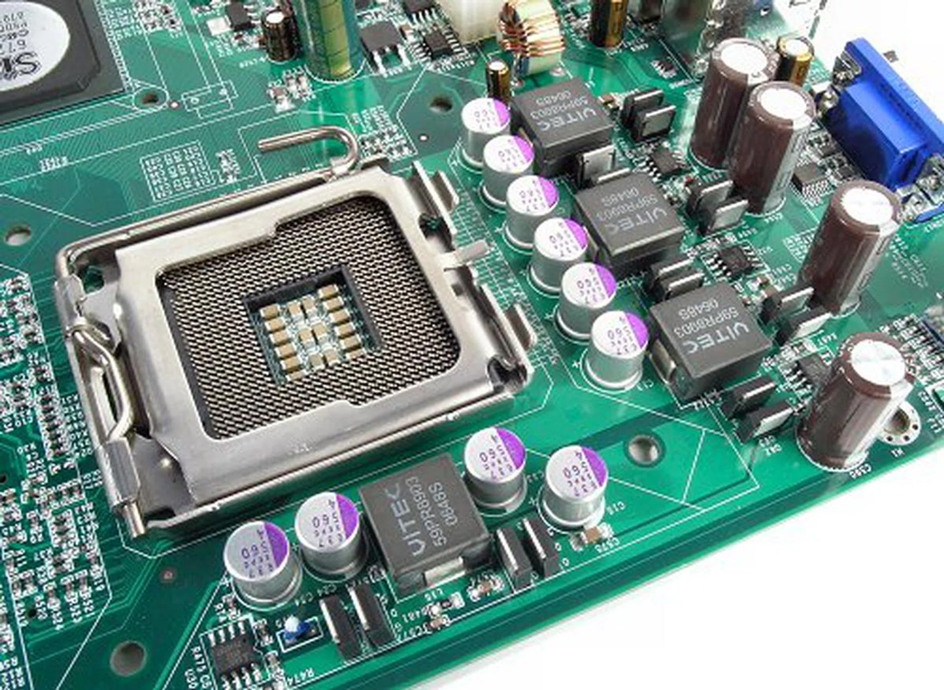 Though the rest of the board looks simple, the PWM components around the CPU socket uses solid capacitors and what looks like digital MOSFETs.