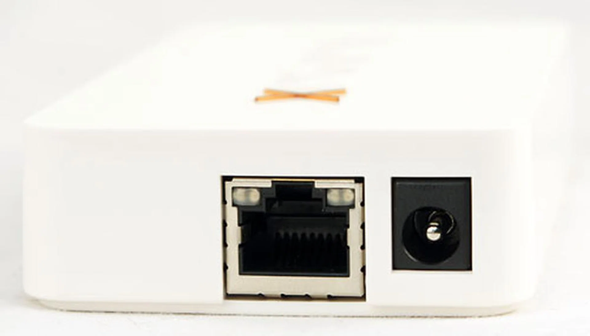 An Ethernet port is all the connectivity the xPrintServer needs. When the LED at the top left of the port lights up in green, it means it's a 100Mbps connection. If it's in orange, it's 10Mbps. A blinking LED indicates activity.