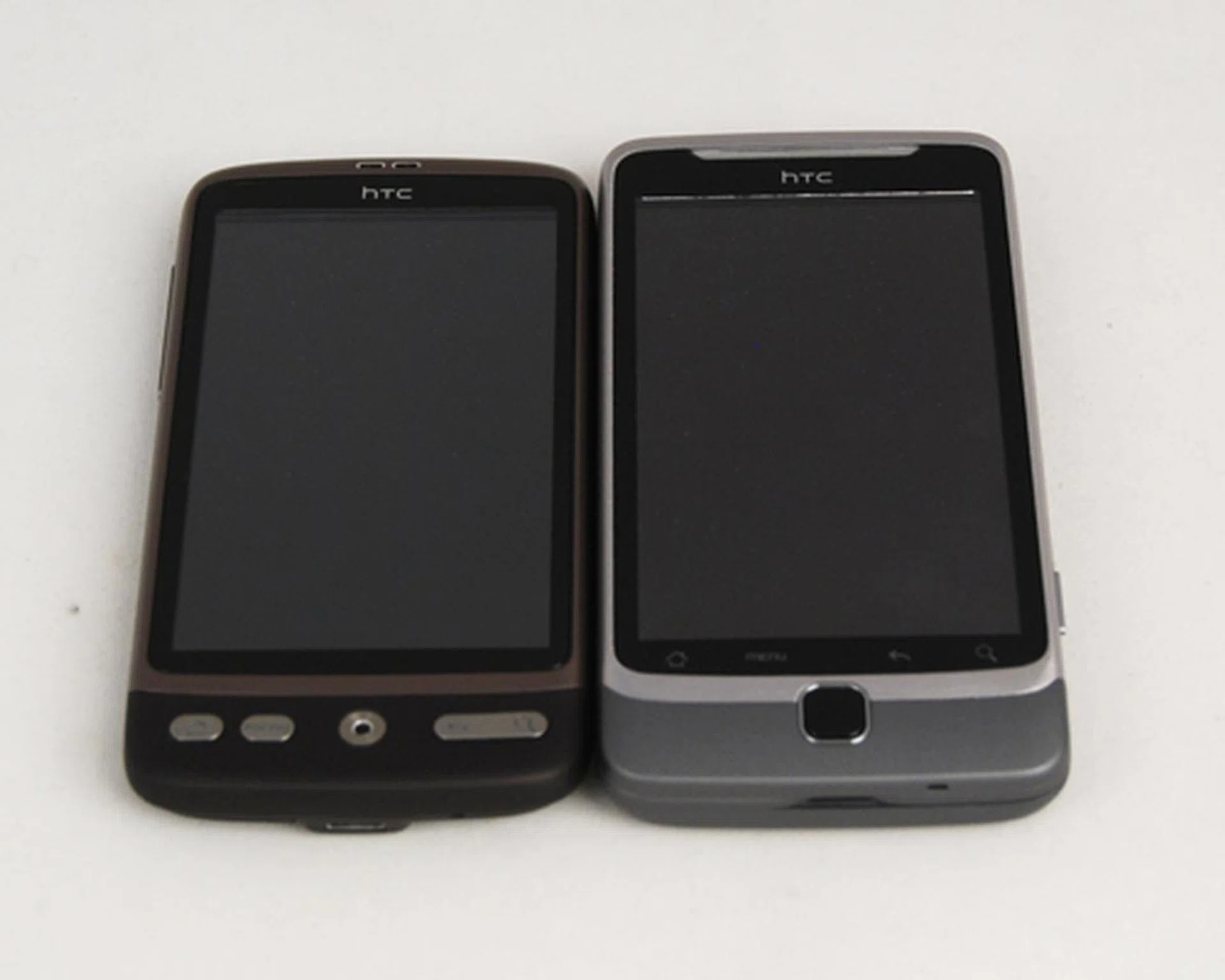 We would have preferred physical buttons (as seen on the HTC Desire, left) instead of four smaller touch sensitive buttons on the front panel.