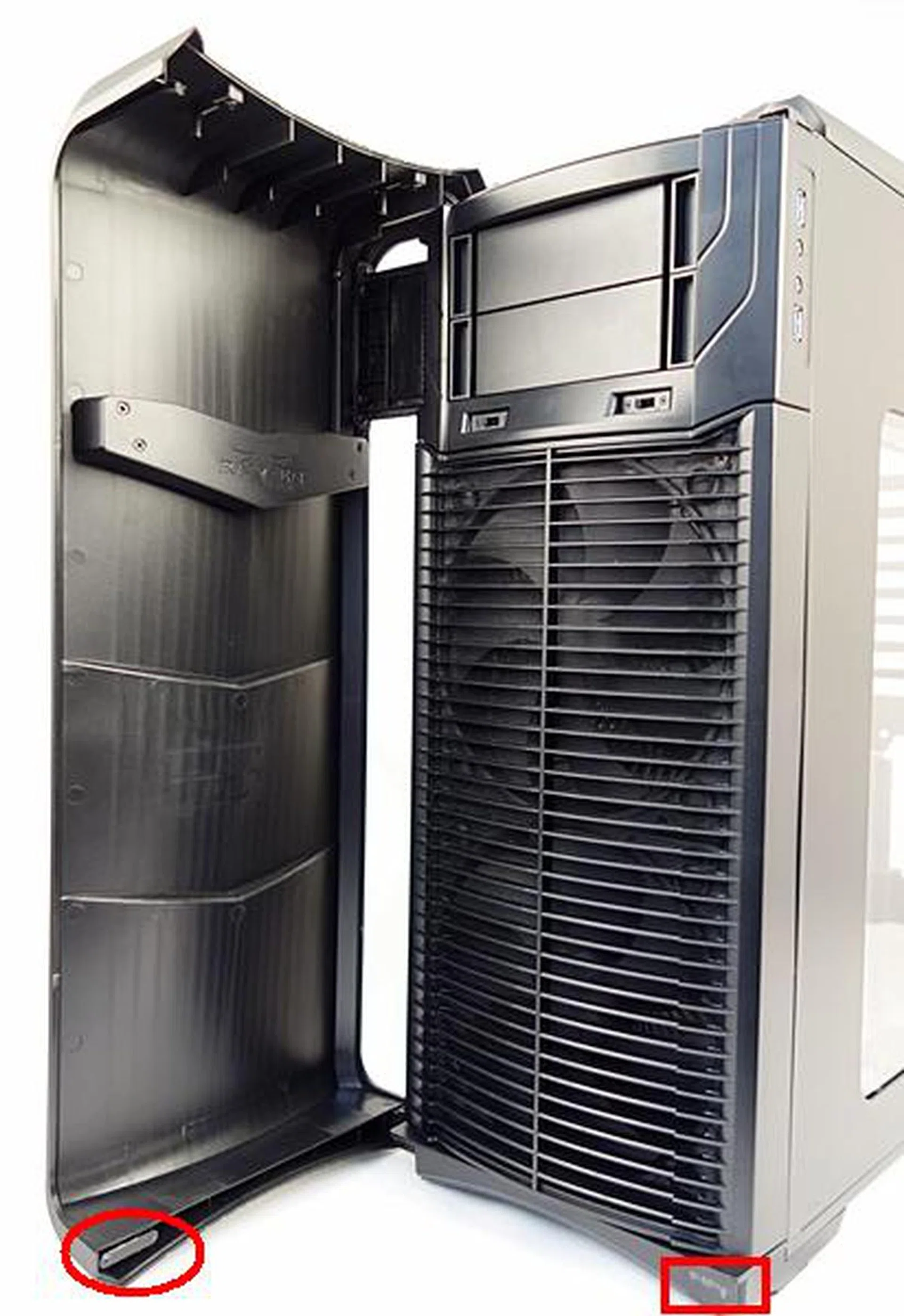 At the bottom of the hinged cover, there is a piece of metal (marked by the red circle) that is attracted to the magnet (marked by the red rectangle) beneath the plastic front panel.