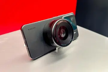 A camera lens that attaches magnetically to the back. Photo: HWZ.