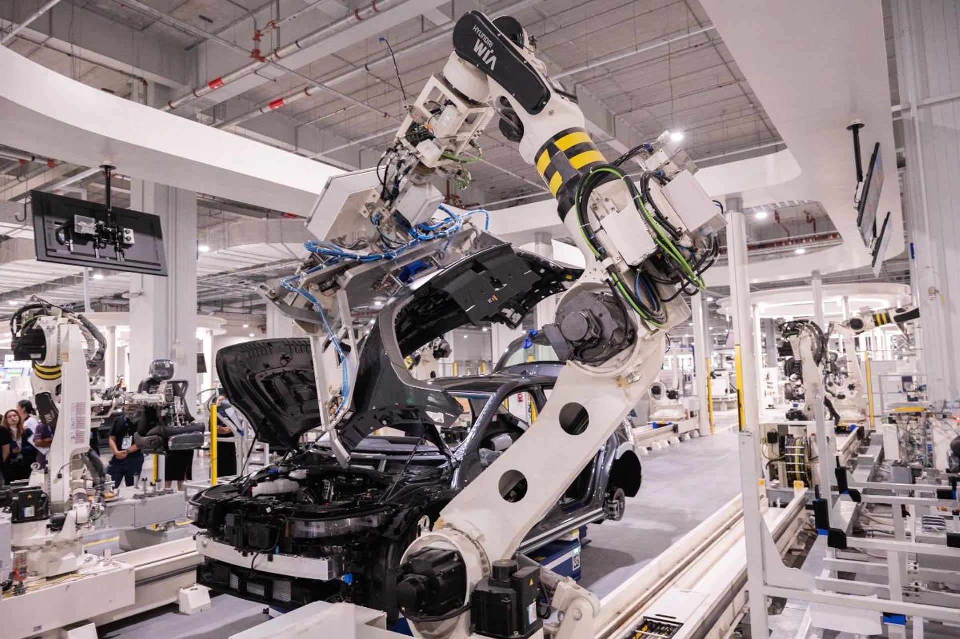 The level of automation is very and much of the car is actually put together by robotic arms such as these. (Image source: Hyundai Motor Group)