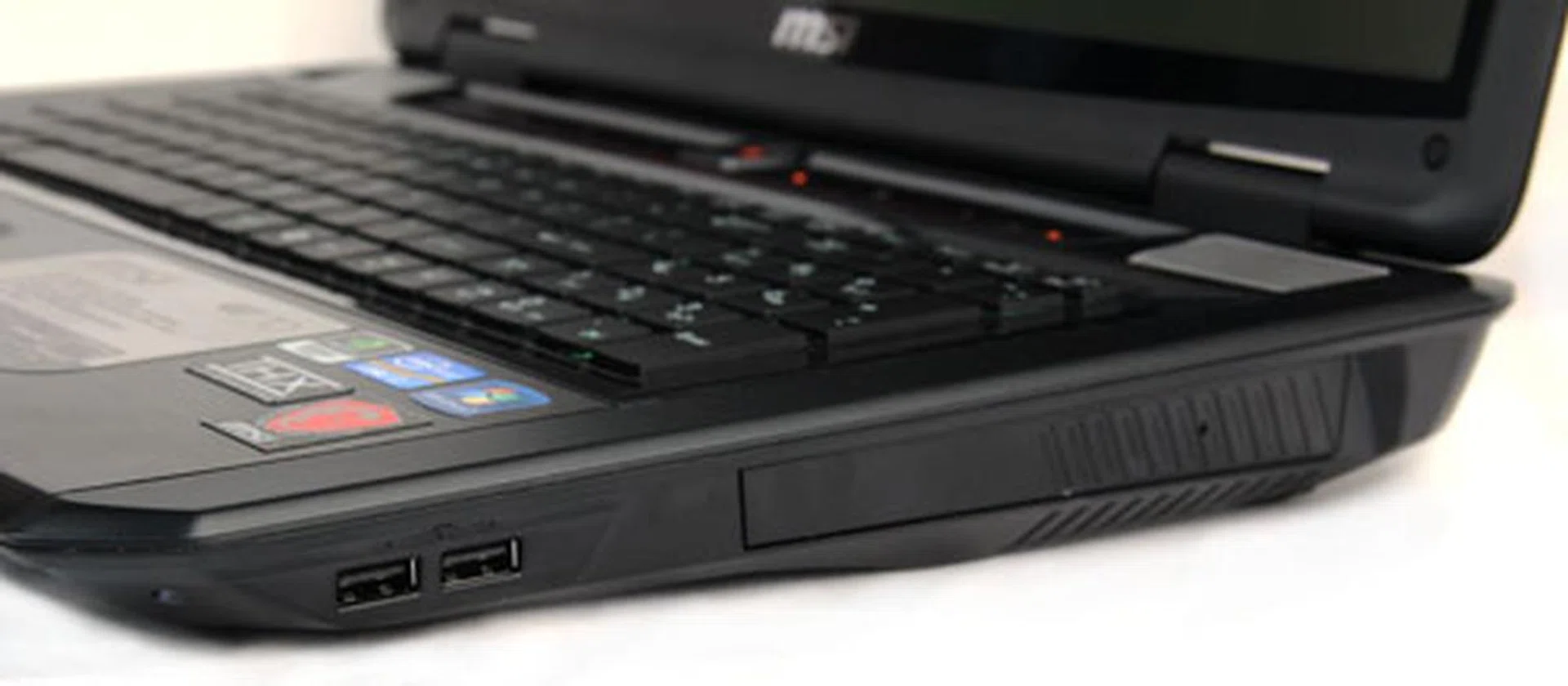 On the right edge, two USB 2.0 ports sit to the left of the Blu-ray drive. You’ll notice the optical drive has no physical button (the eject button is found on the touch panel above the keyboard).