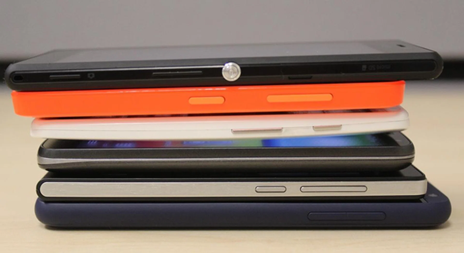 The right side profiles of the six phones. <br> Bottom to top: HTC Desire 610, Huawei Ascend G6 4G, LG G2 Mini LTE, Motorola Moto X, Nokia Lumia 635 and the Sony Xperia M2.