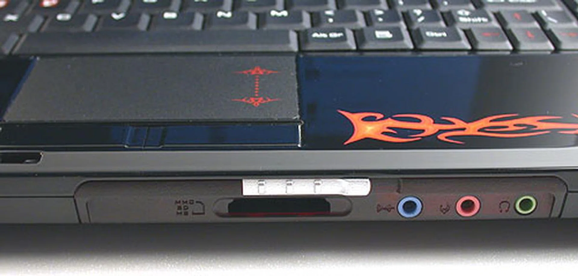 The fiery emblem is etched underneath the shiny black plastic surface so it won't suffer the indignity of wear and tear/fading. 