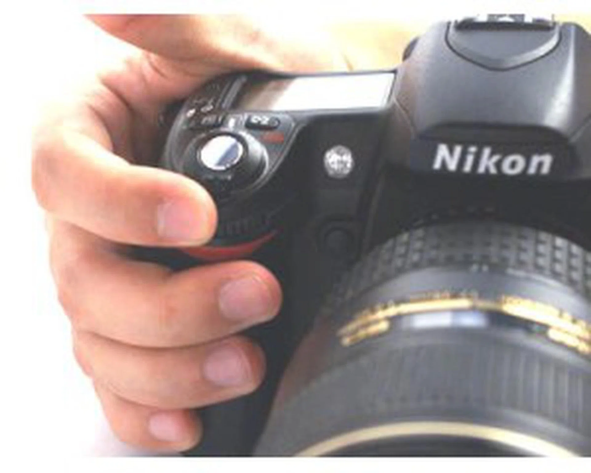 The index finger naturally lands on the front dial when you grip the camera.