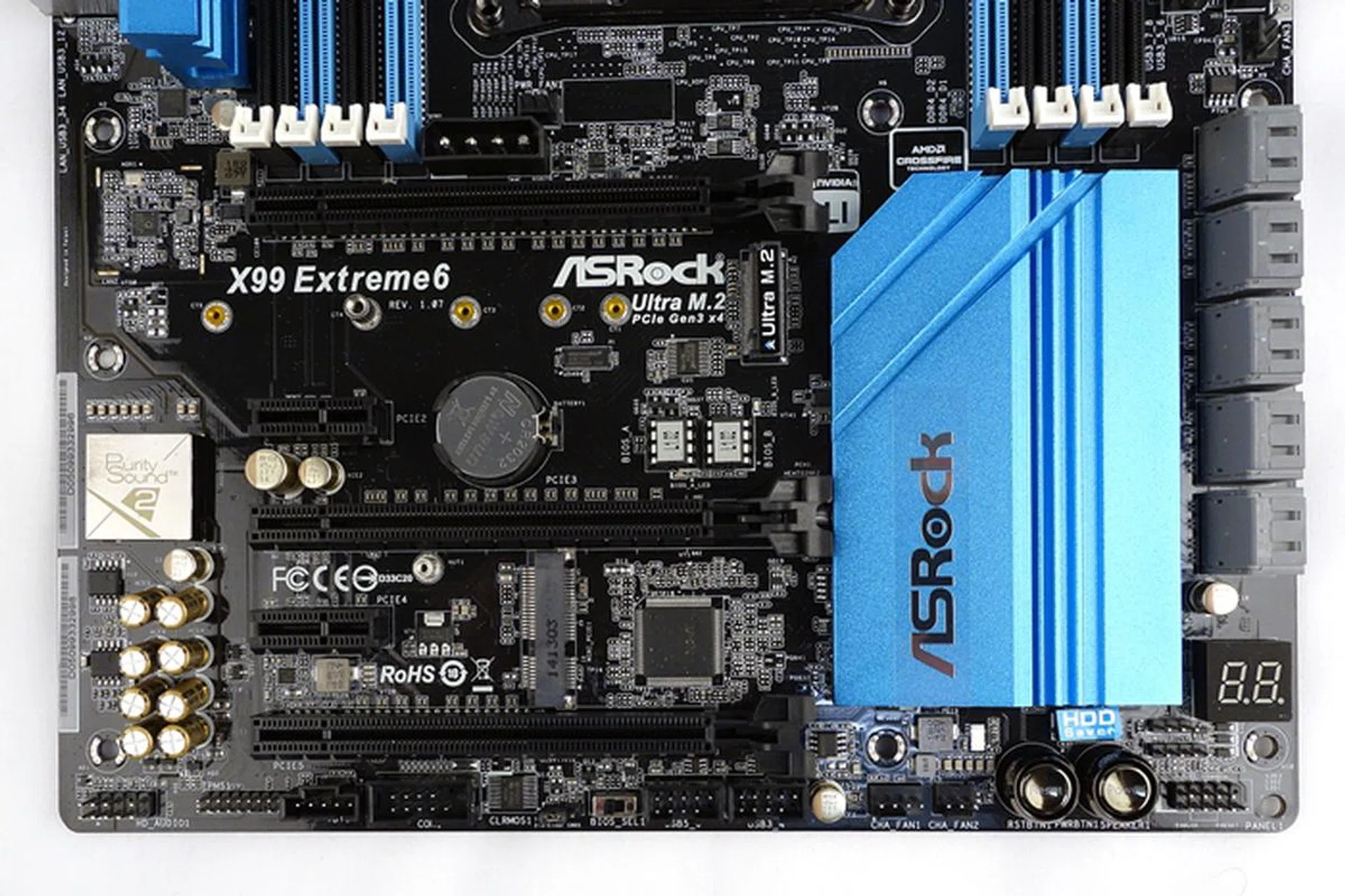There is a BIOS selection switch at the bottom edge. Like most high-end boards, there is a pair of onboard buttons for turning on or resetting the system. Also note that between the last two PEG slots, you'll fined a Mini PCIe slot.