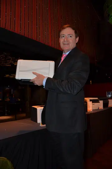 James Henderson, President, Asia Pacific & China of Fuji Xerox Printer Channel, holds the small DocuPrint P205 b.