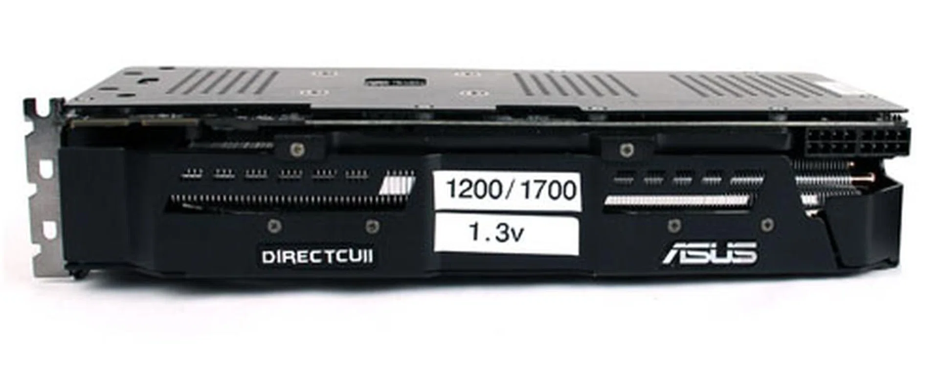 You can see how thick the ASUS' Radeon HD 7970 is, taking up three PCIe slots when installed. It uses two Molex 8-pin power connectors. The sticker that you see plastered on the top are clock and voltage settings used by ASUS to overclock our test card.