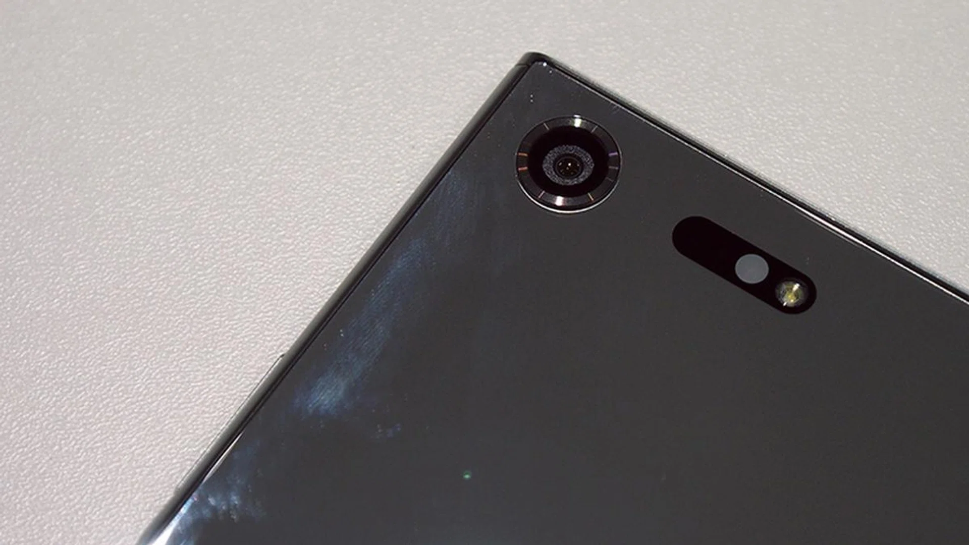 The array to the right of the lens is its Triple Image Sensing technology.