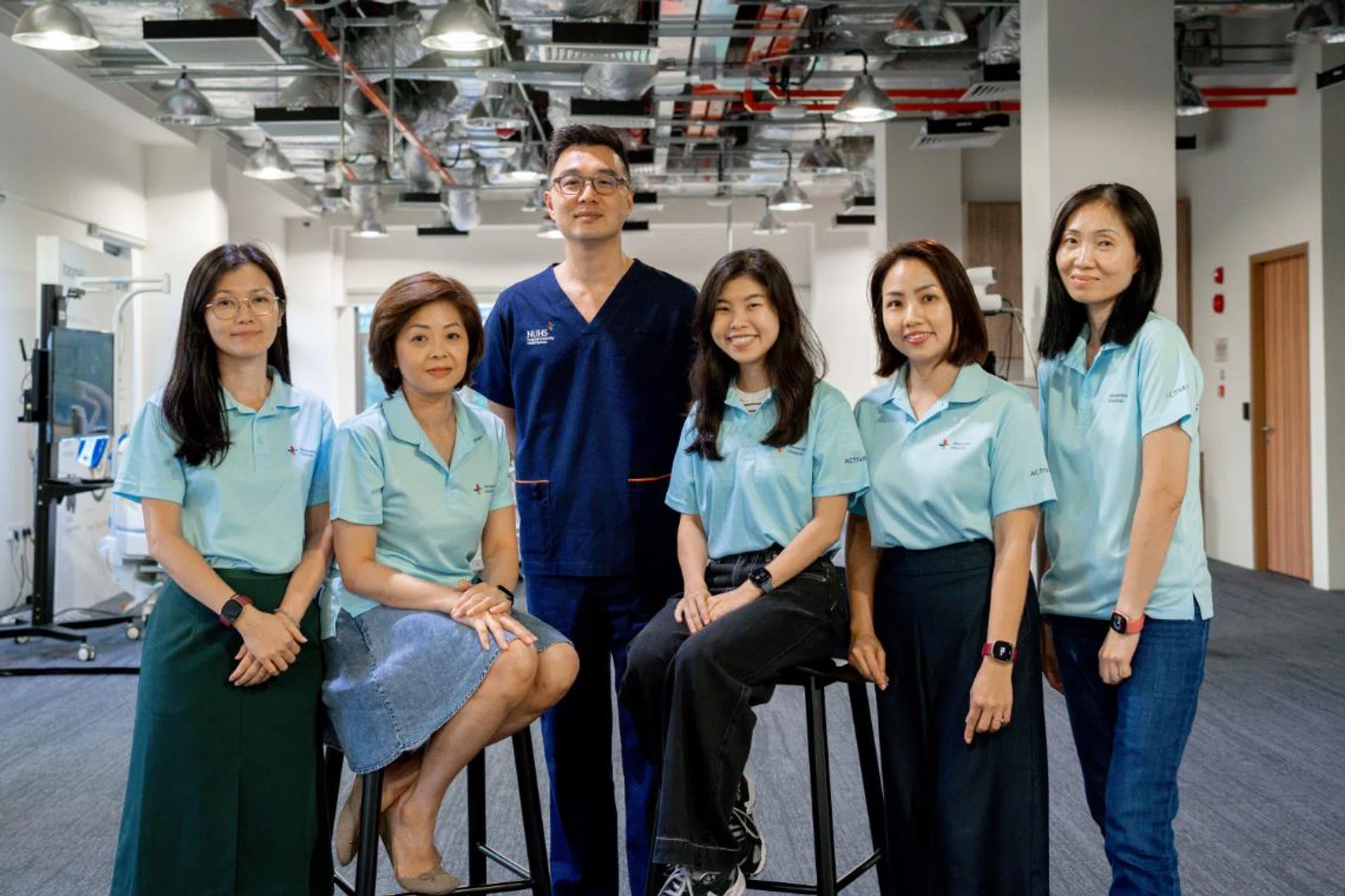 Dr Alexander Yip and the three DHGs and Research Fellow Elya and
Project Manager Carmen. Photo: Alexandra Hospital
