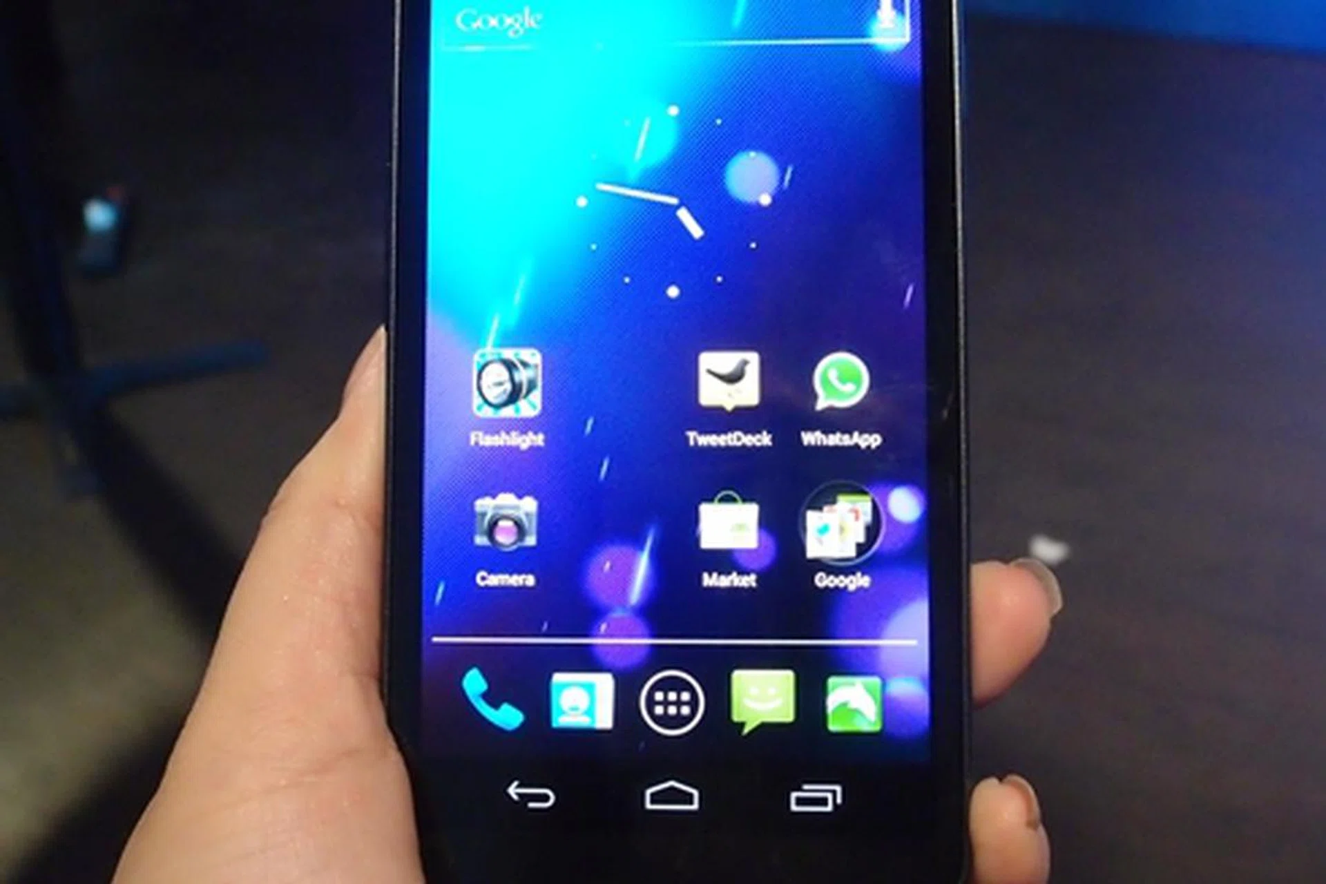We managed to take a quick snapshot of a Samsung representative's Galaxy Nexus handset. The 4.65-inch Super HD AMOLED touch screen and on-screen navigation buttons, among other things, differentiate the handset from the others.