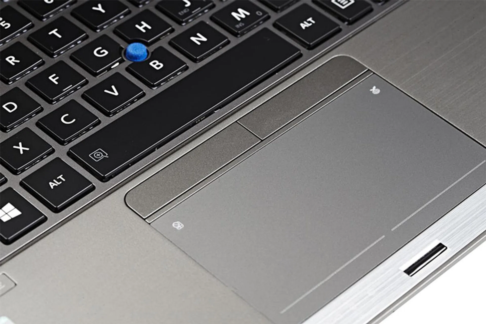 The groove lines guide your fingertips to the clicking areas when your eyes are glued to the screen. You can also use the separate left and right click buttons, which we prefer when we engaged in drag-and-drop actions.