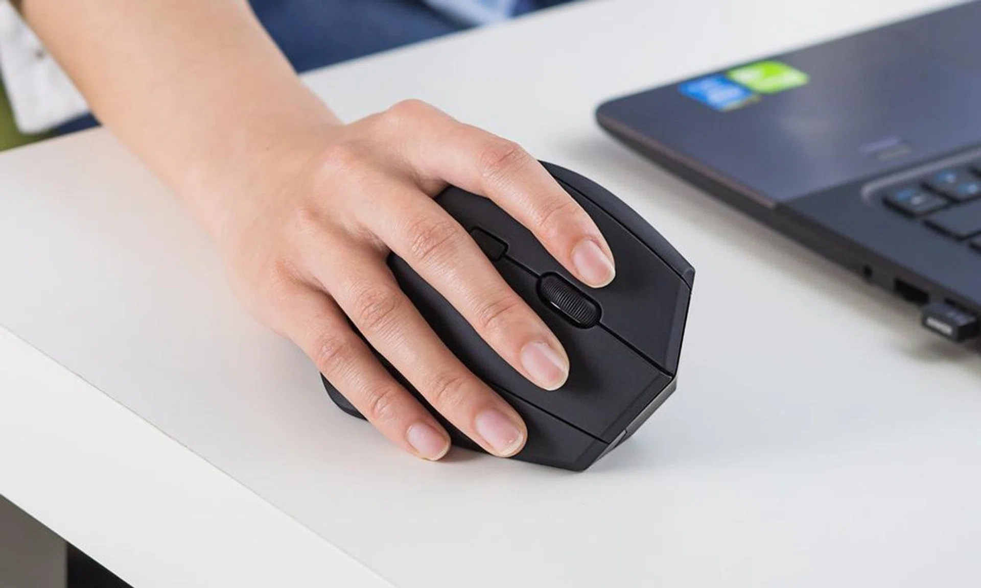 Not my hand, but you can see how the last finger brushes against the table.