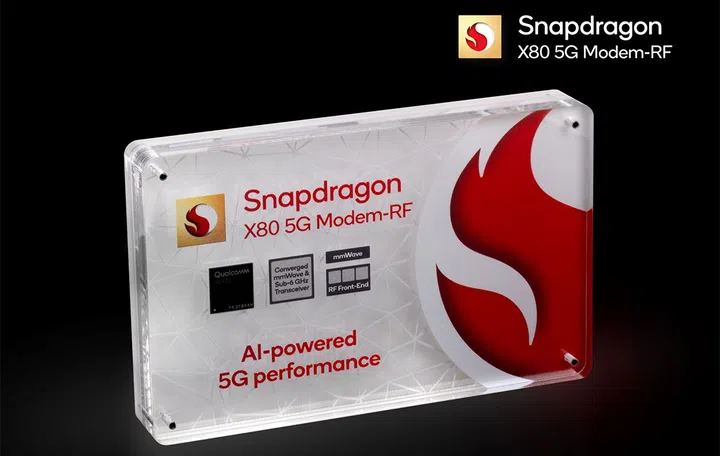 The Qualcomm Snapdragon X80 5G modem is encased in a block of showy glasstic at MWC 2024.