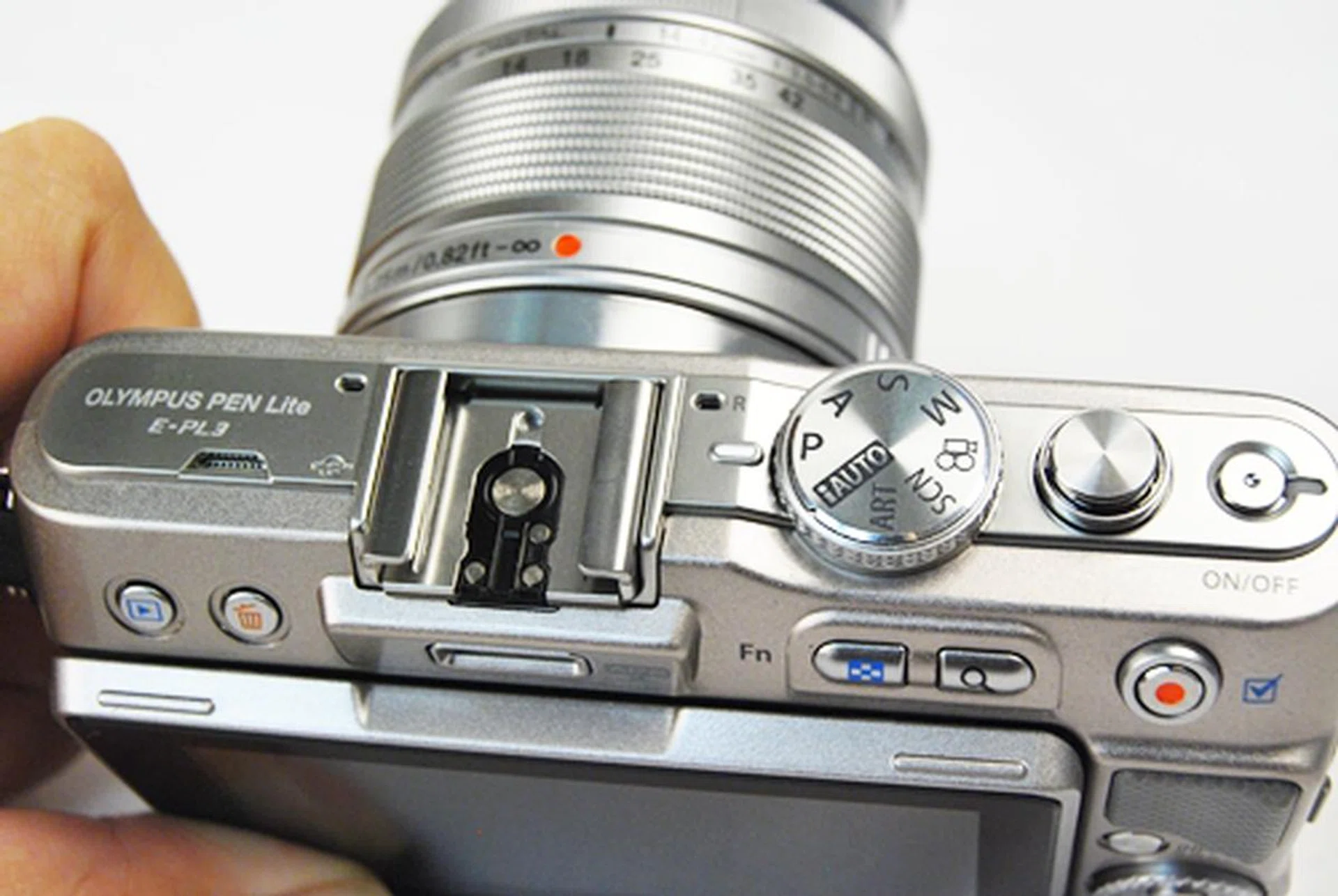The lack of a flash makes the top less cluttered. Nonetheless, all essential buttons are still located on the top within easy reach - mode dial, shutter and power buttons.